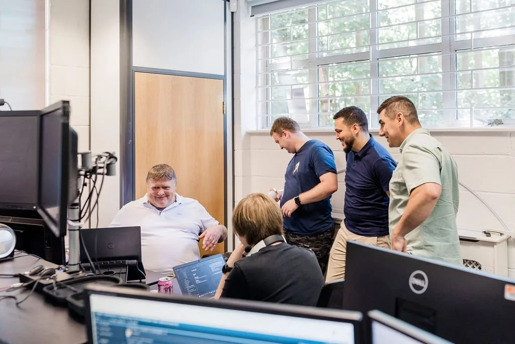 Fifosys engineers, sat talking as they work