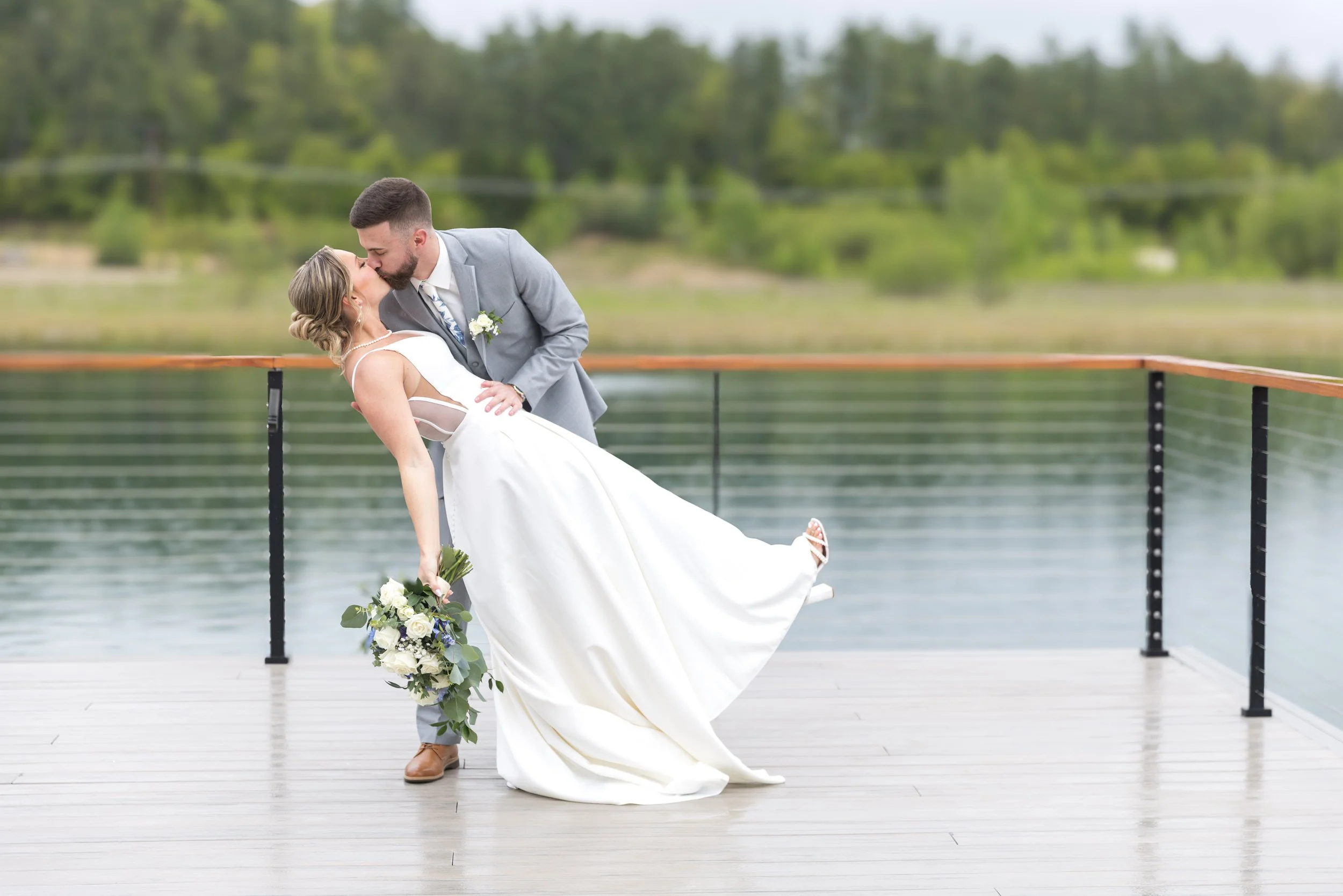 owls-nest-wedding-dip-kiss-lakefront.jpg
