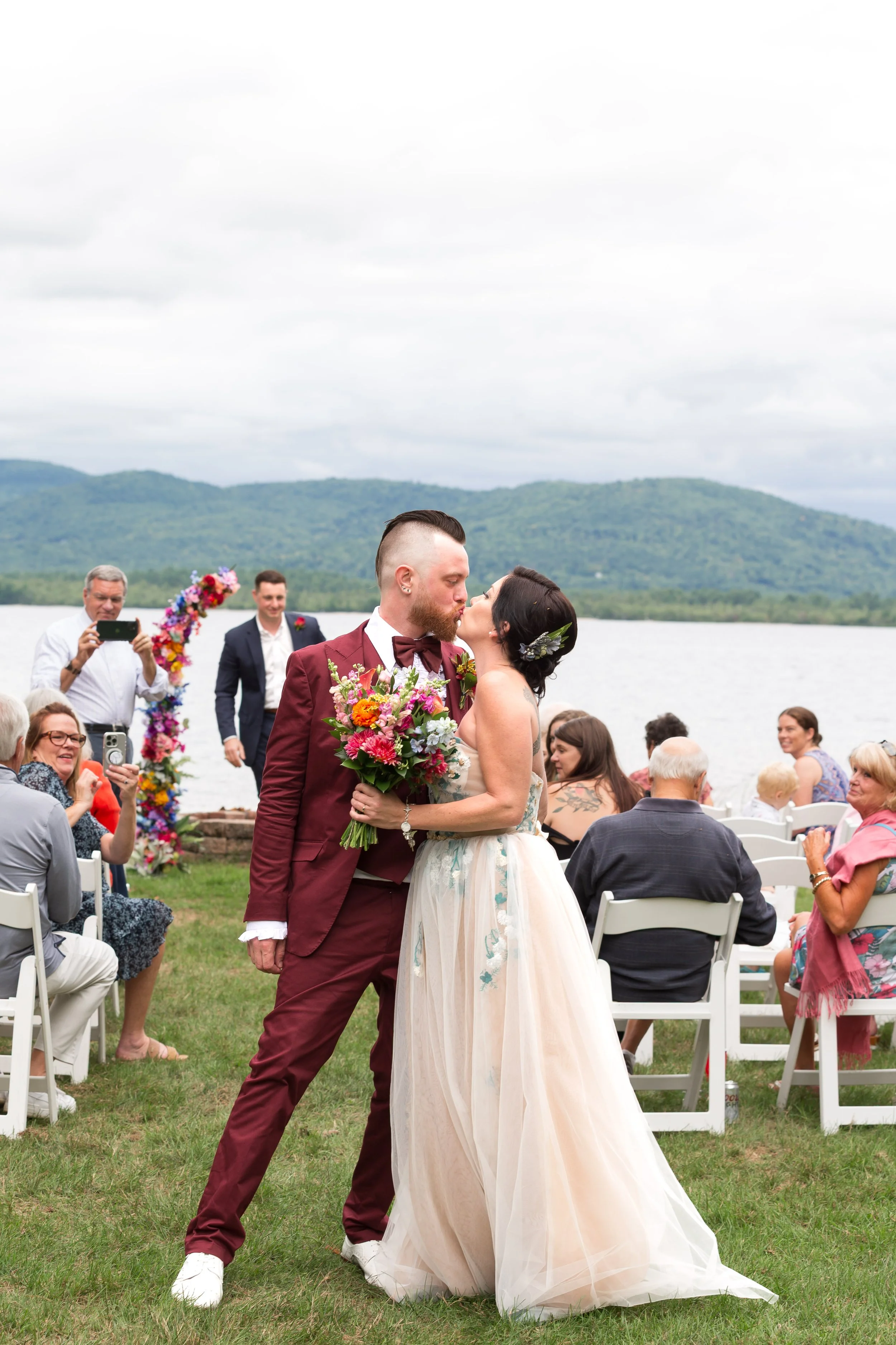 lake-winnipesaukee-wedding-ceremony-kiss-new-hampshire-chelsea-gorasia.jpg