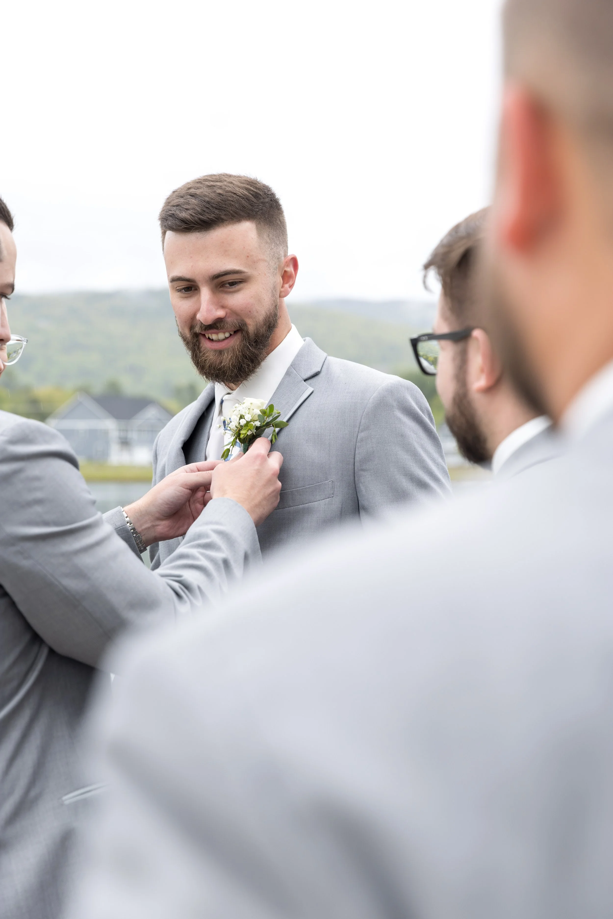 owls-nest-wedding-groom-boutonniere-getting-ready.jpg