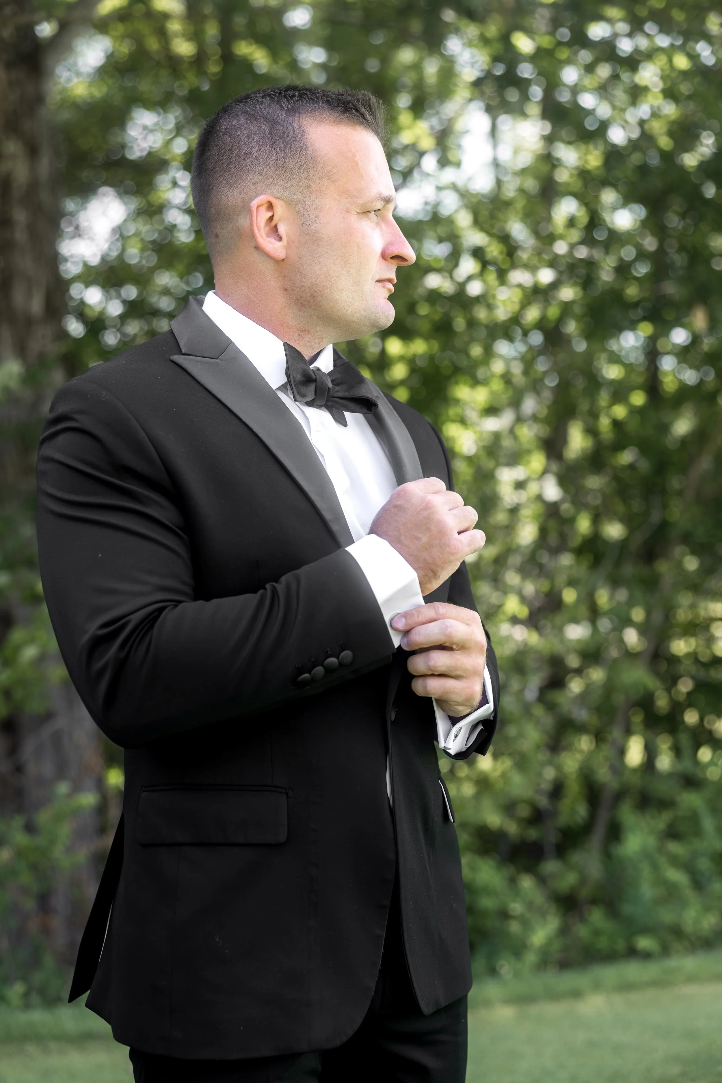 owls-nest-resort-groom-portrait-black-tuxedo.jpg