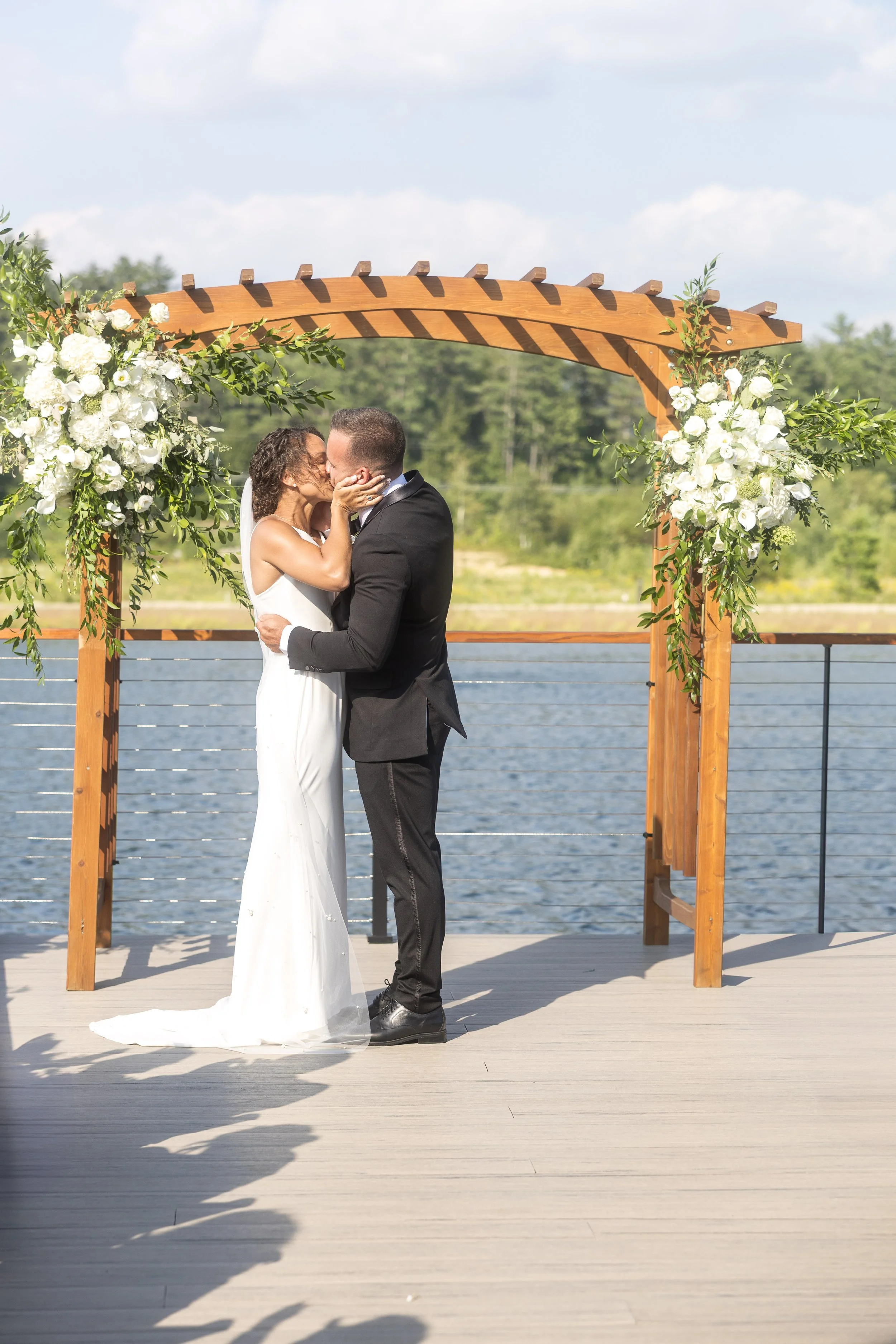 owls-nest-resort-lakefront-ceremony-kiss.jpg