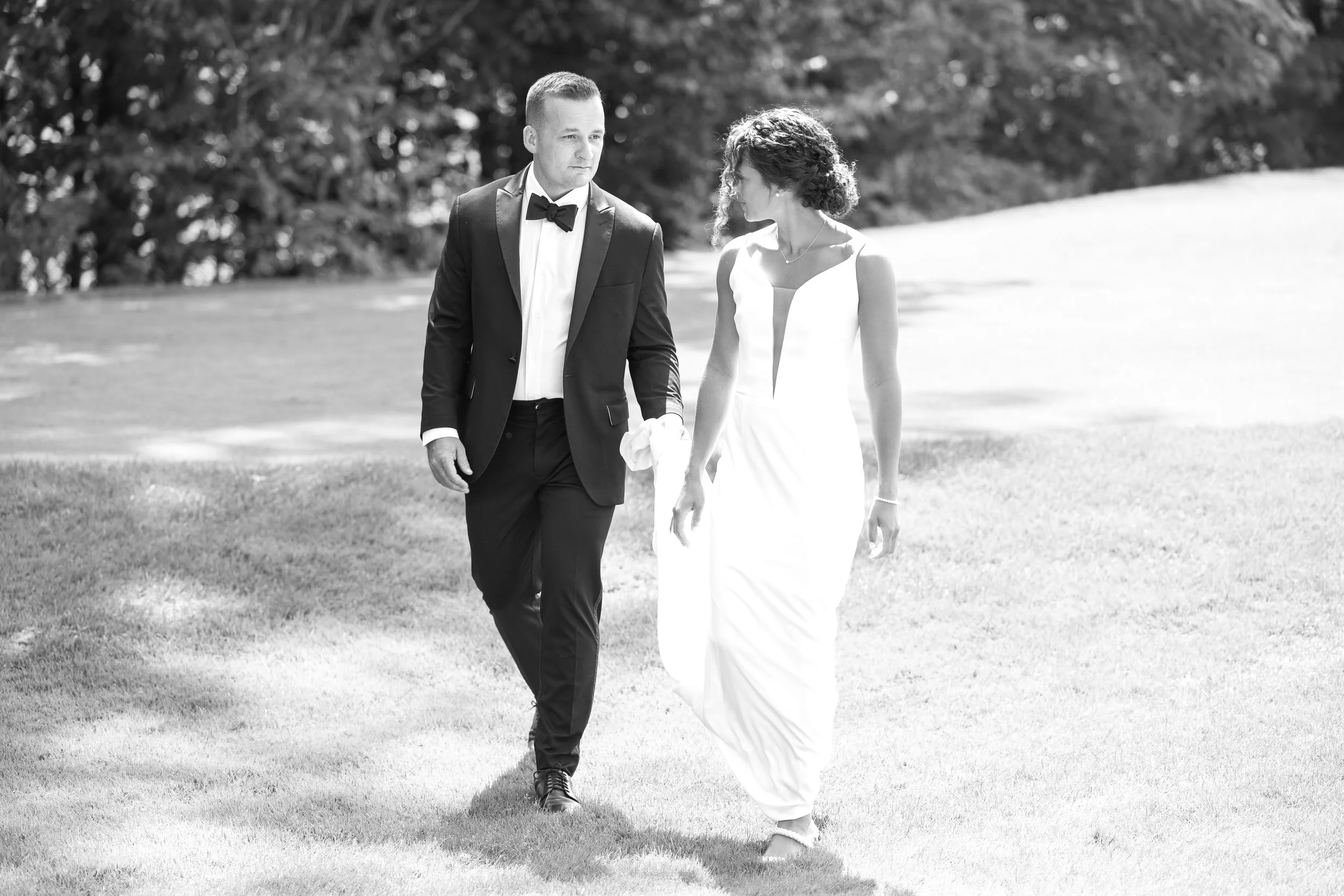 Bride and groom walking together during a White Mountains New Hampshire wedding.