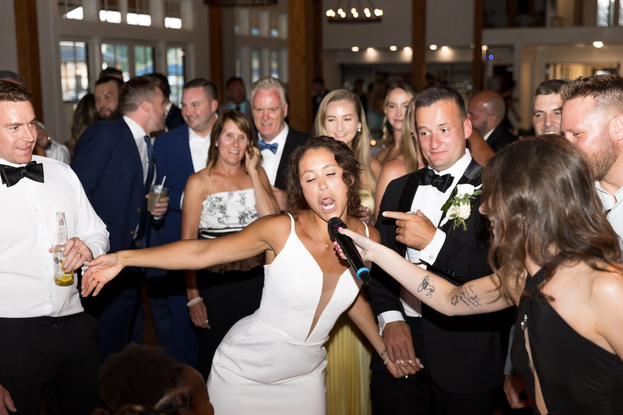 owls-nest-wedding-reception-bride-singing-dance-floor.jpg