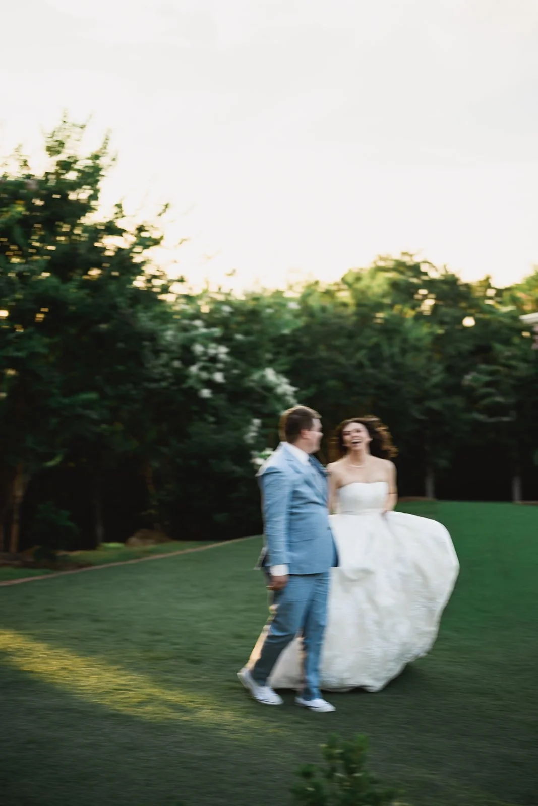 Wedding photos of couple running