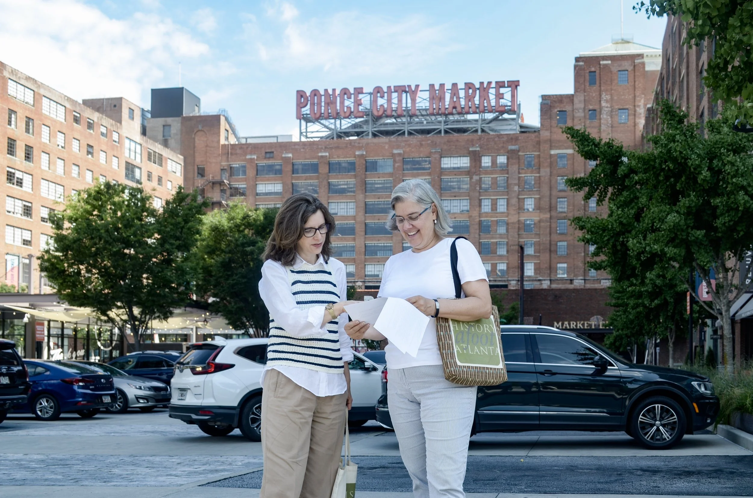 Guides prepare for guests for a walking tour near Ponce City Market