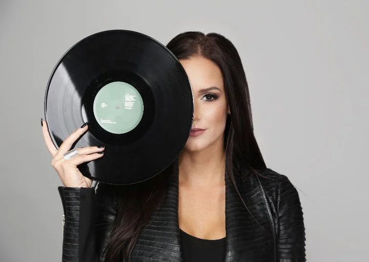 photo shoot cover for DJ Yvonne. Beautiful color in her black leather jacket posing in scottsdale Arizona for photographer Alex Branding Phoenix