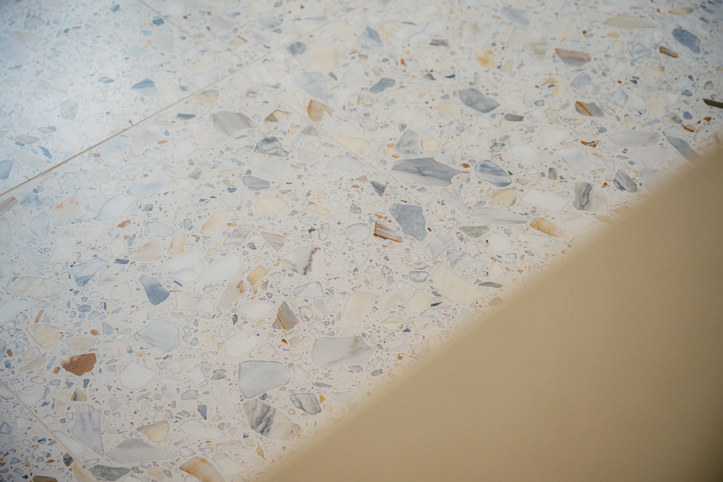 terrazzo-timber-terrazzo-tile-detail-orange-blue-stone-chips.jpg