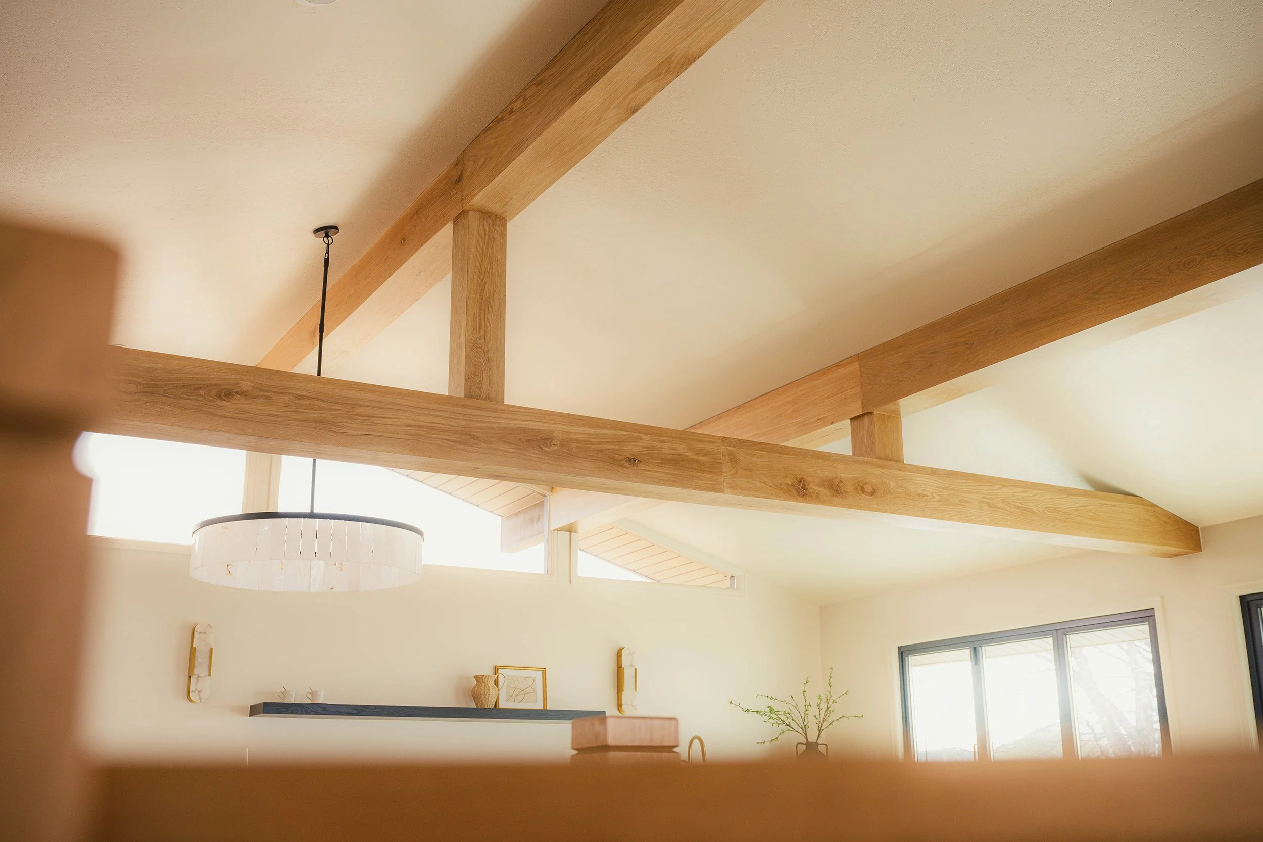 terrazzo-timber-oak-box-beams-cream-ceiling-warm-light.jpg