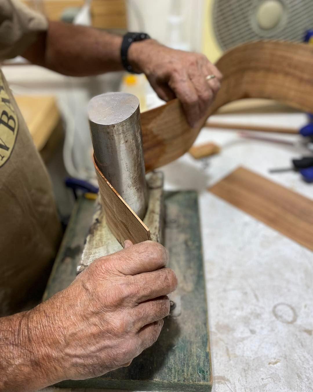 Noel hand bending the side. #guitarbuilder #australianmade #dowoodworking #guitarmakingcourse #tonewood #acousticguitar