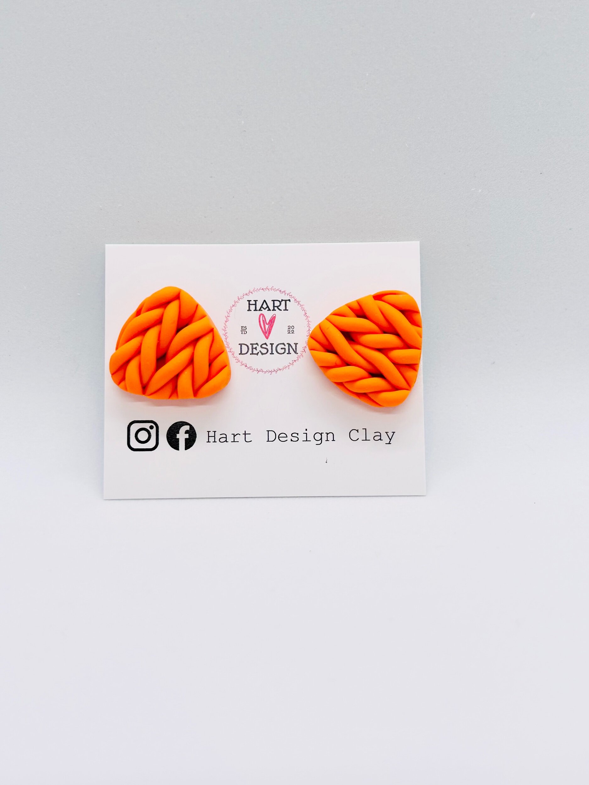 Orange knit triangle stud