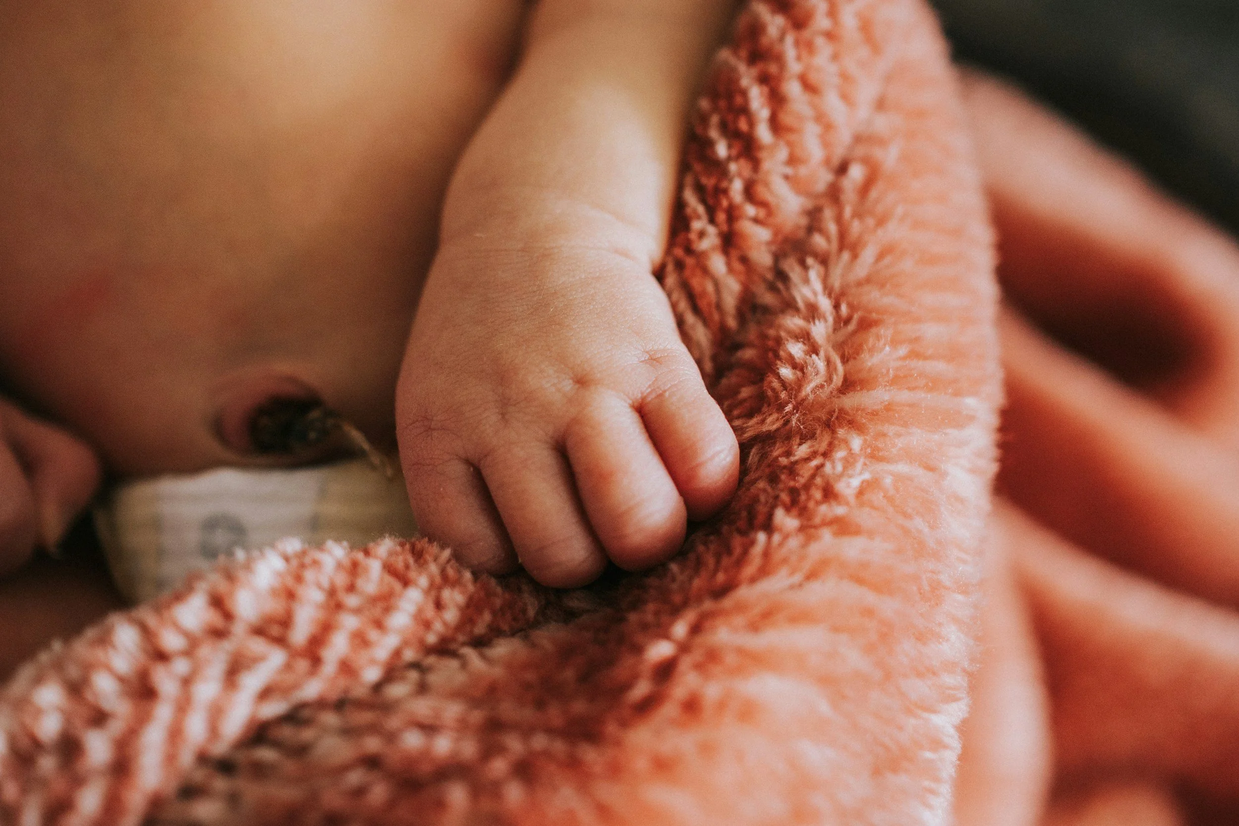 New baby with umbilical cord stump still attached.