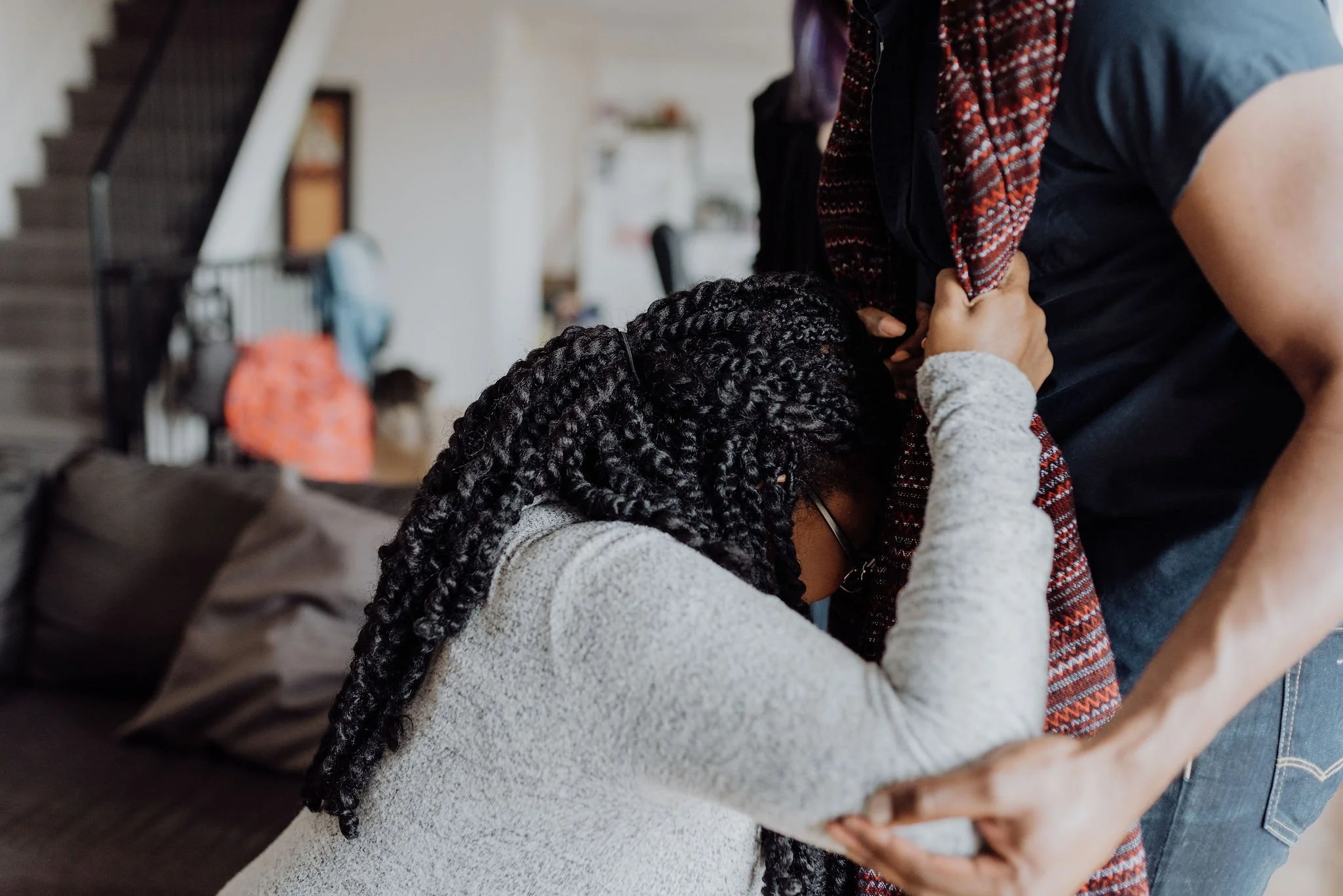 Pregnant mother and her partner using a rebozo for natural comfort during labor.