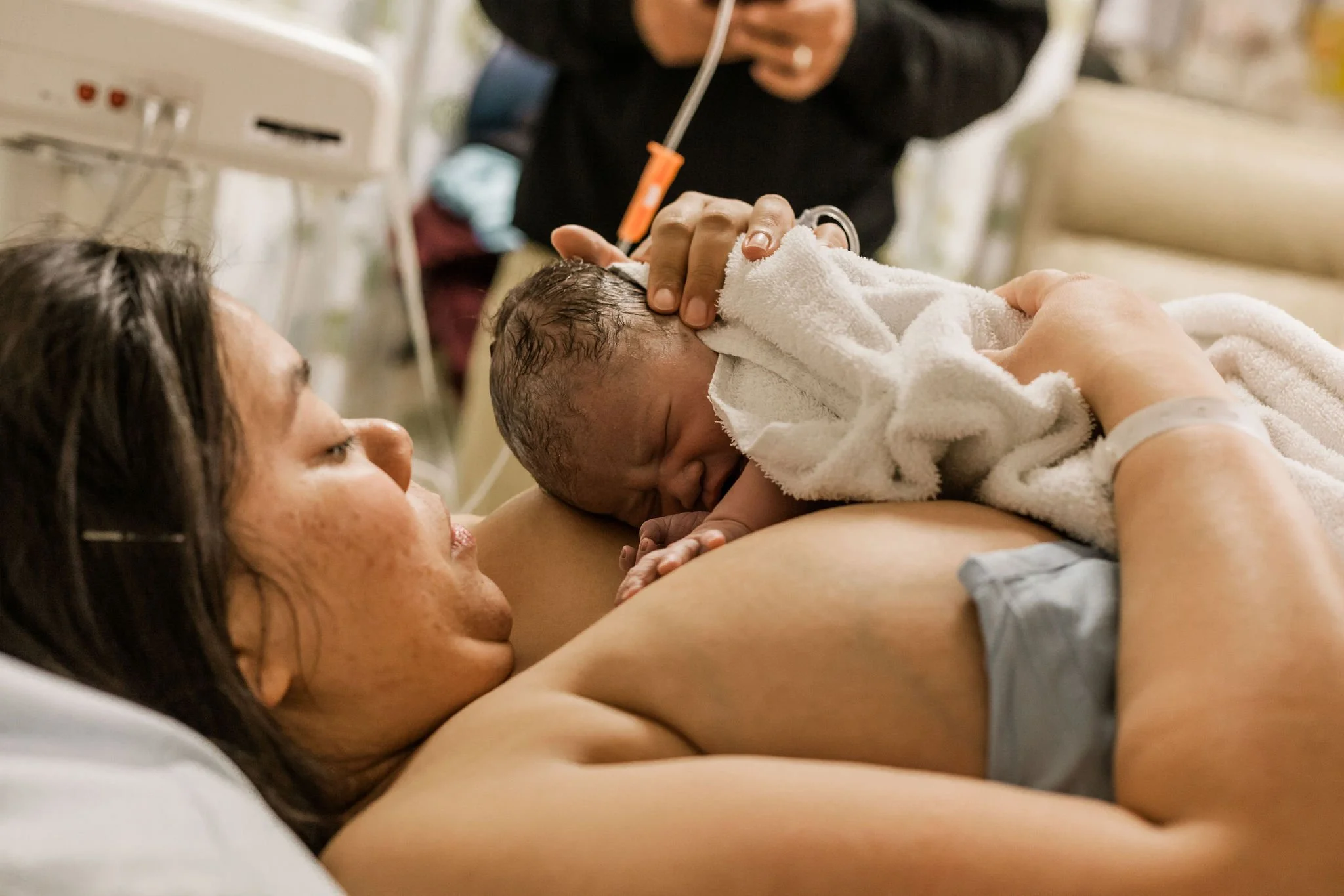 VBAC mom holding her new baby.