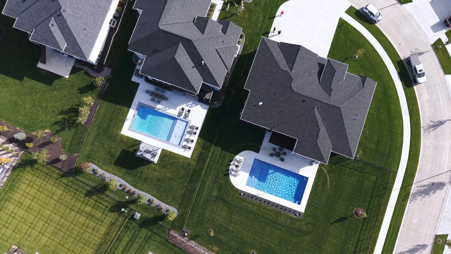 custom pool and patio in Omaha, NE featuring coordinated outdoor living spaces for neighbors
