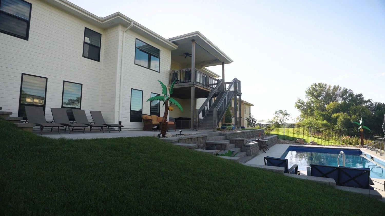 engineered to transform a steep backyard into a usable outdoor space with a pool