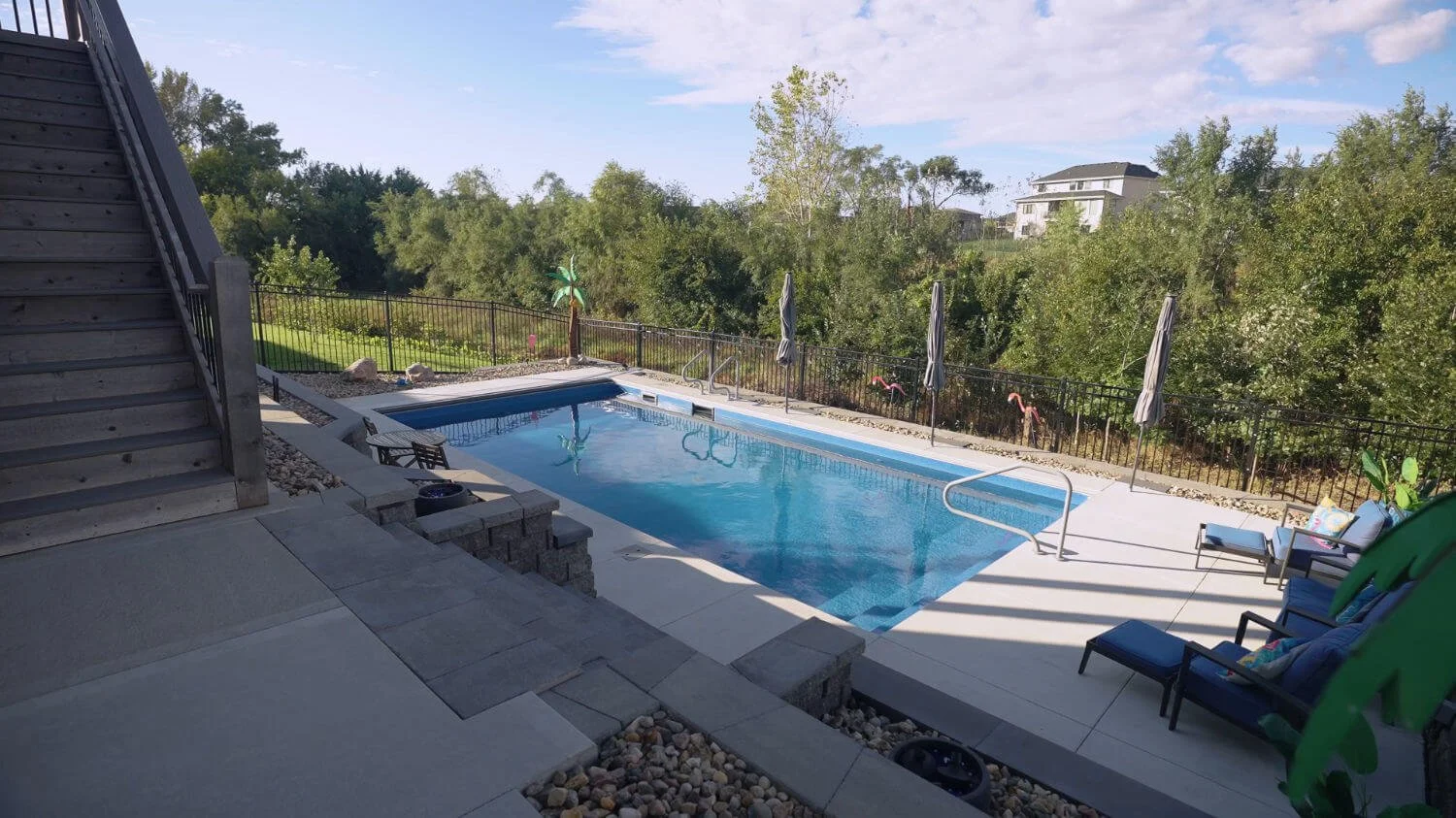 pool built into a sloped backyard for long-term outdoor enjoyment