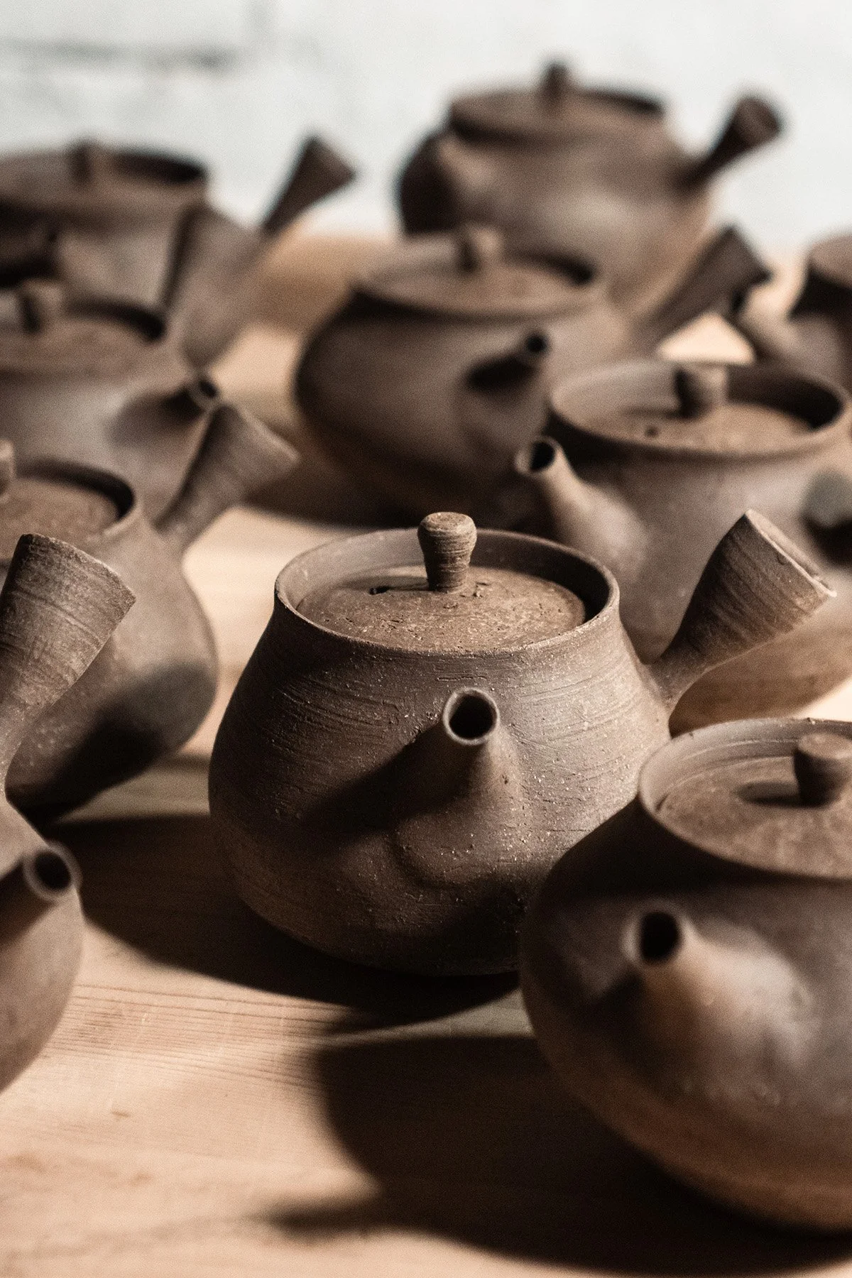 Handmaking ceramic kyusu teapots on the wheel as part of a slow pottery making process.