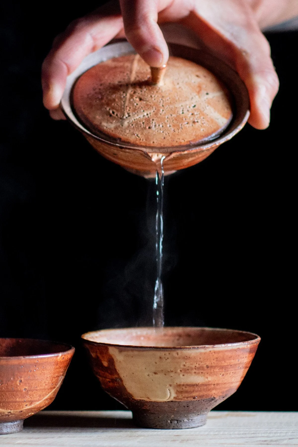 Brewing tea with a handmade shiboridashi teapot designed for slow and intentional tea preparation.