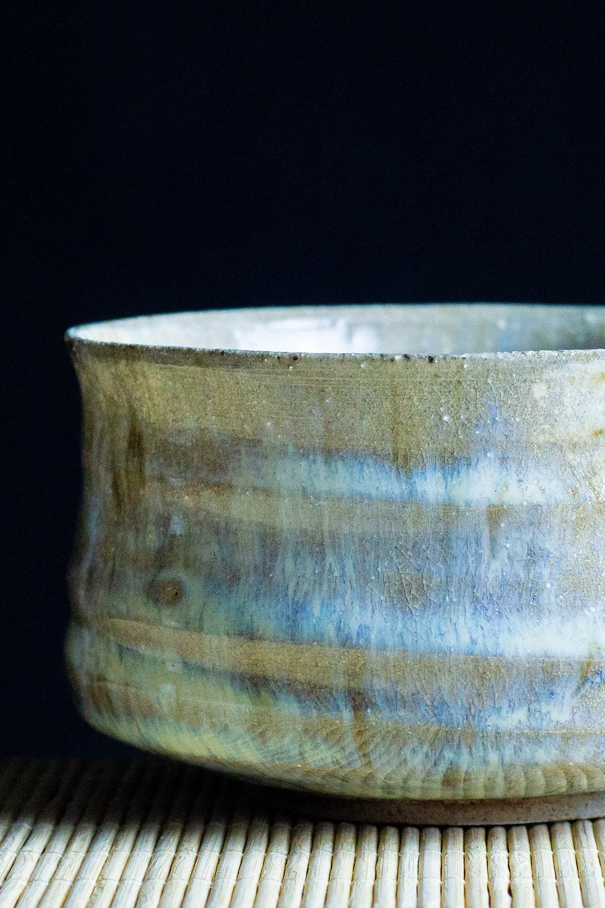 Wood fired ash glazed teaware with natural textures and surfaces shaped by flame and ash.