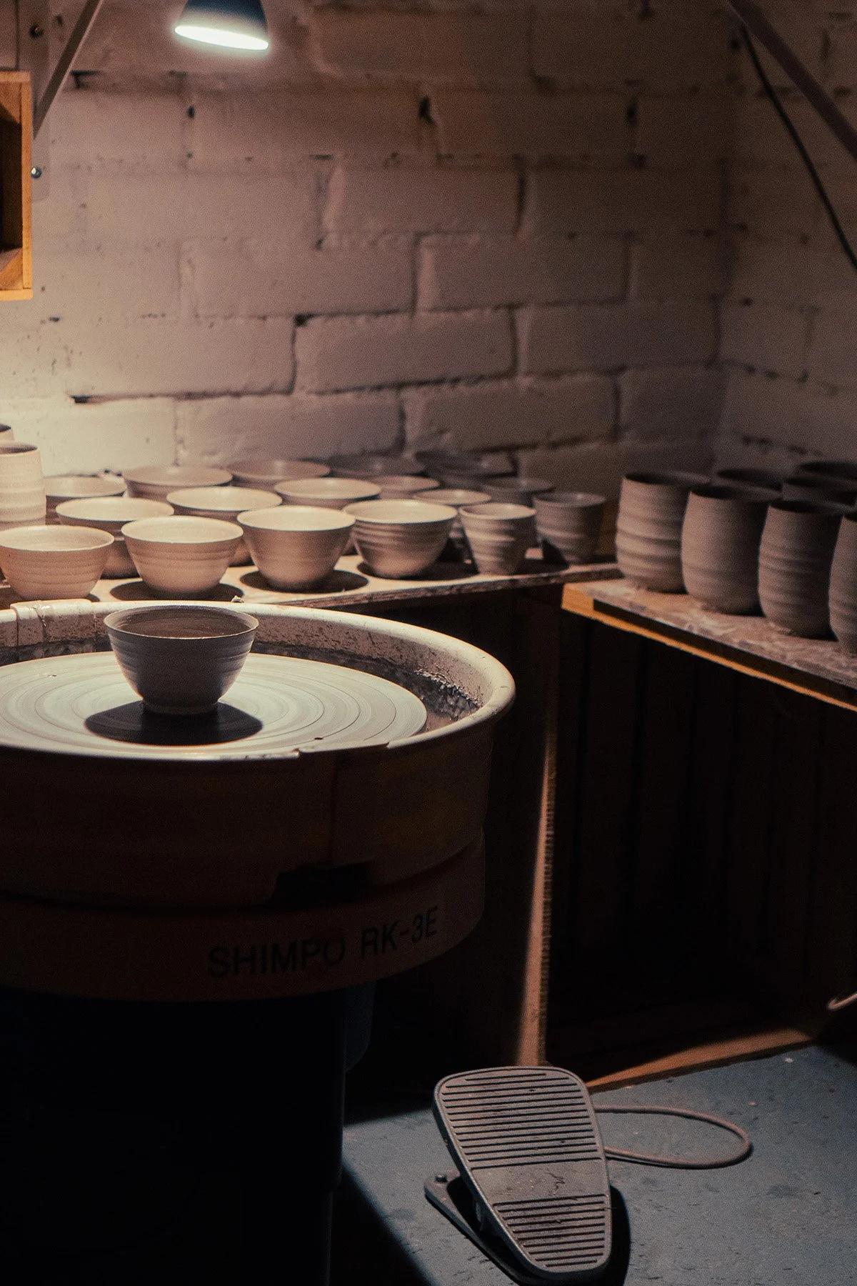 Quiet moments inside the pottery studio where handmade teaware and ceramic objects are created.