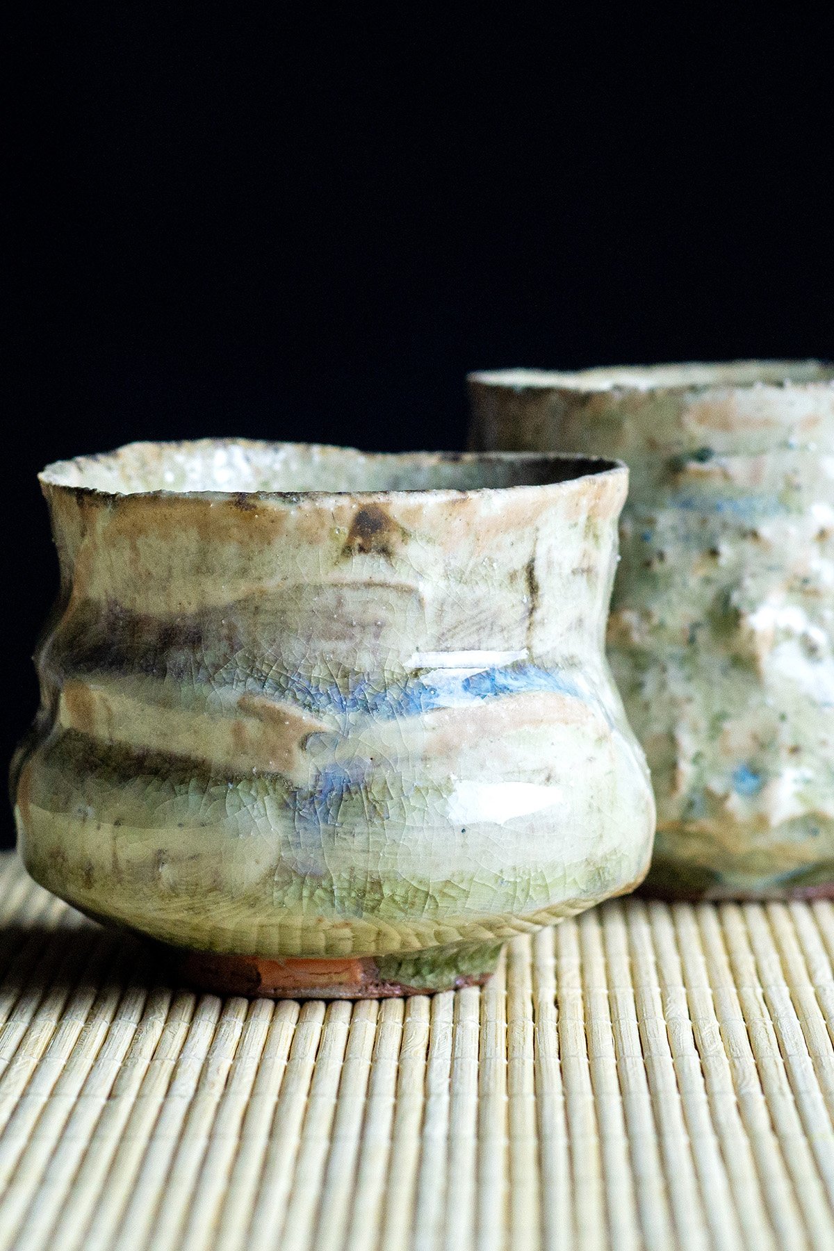 Ash glazed ceramic cups made for daily tea rituals, featuring soft textures and natural wood ash surfaces.