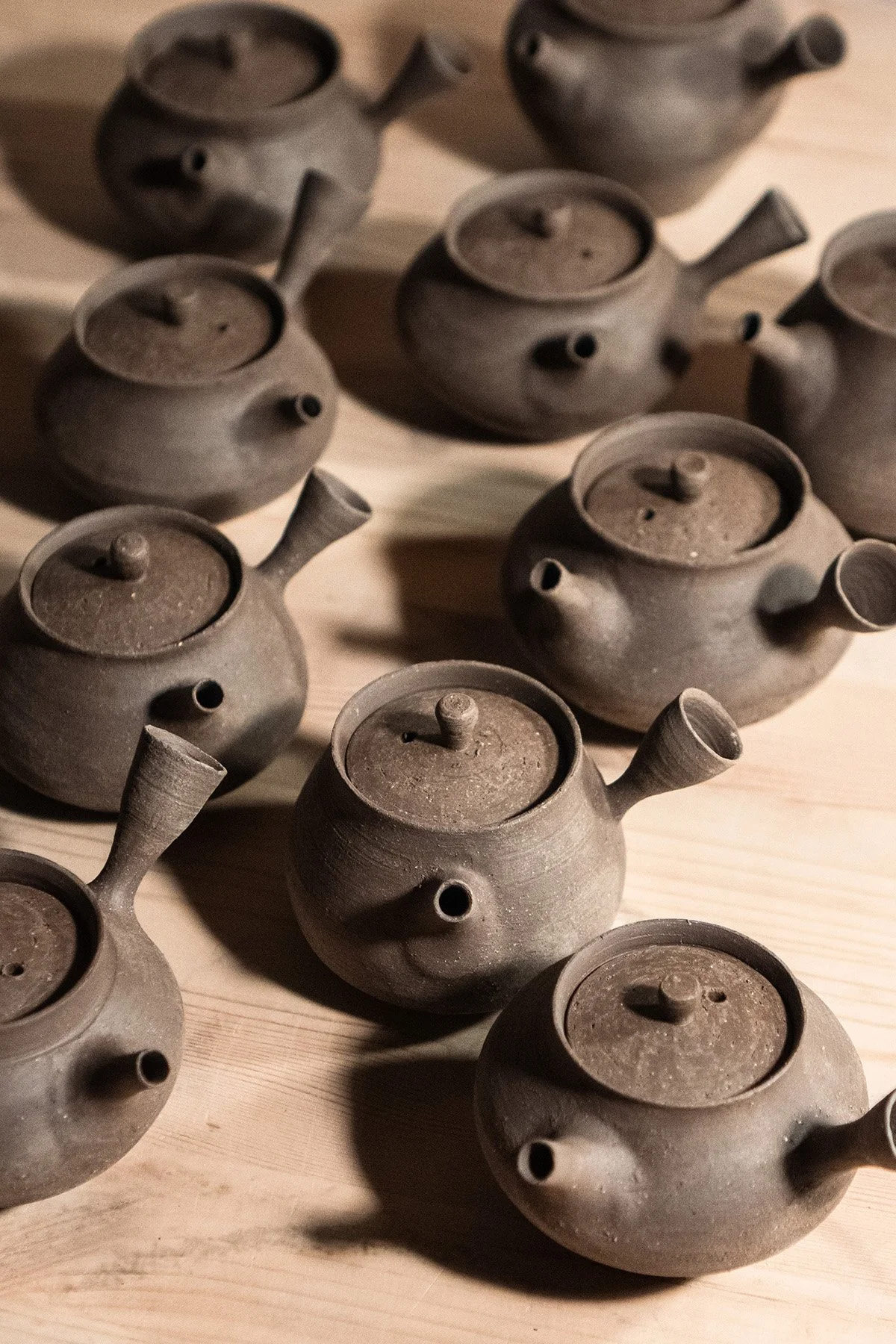 Handmaking ceramic kyusu teapots on the wheel as part of a slow pottery making process.