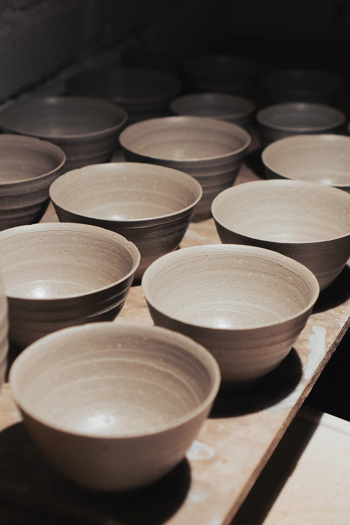 Freshly thrown white stoneware teabowls