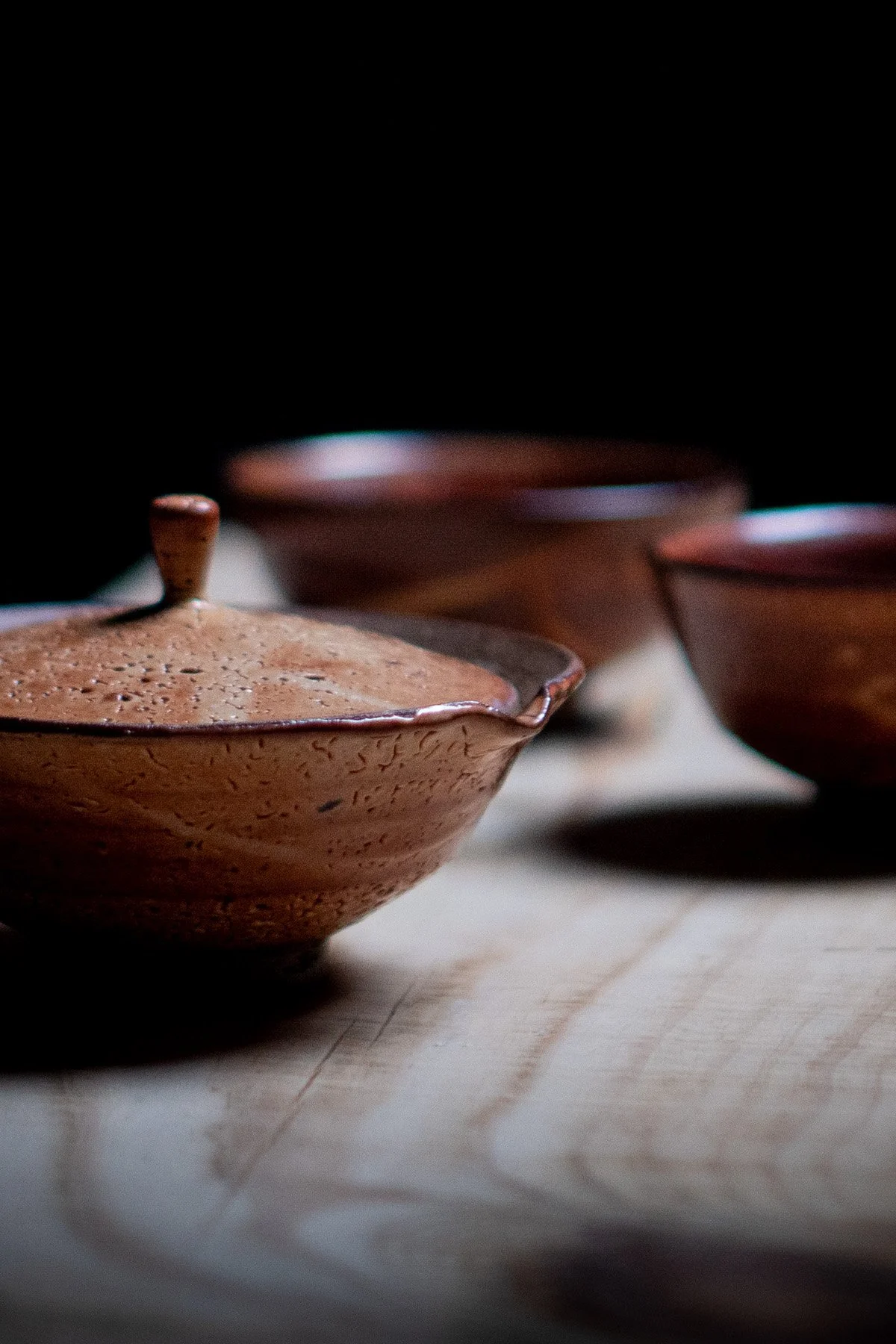 Minimal shiboridashi teapot used for slow tea rituals and delicate loose leaf tea brewing.