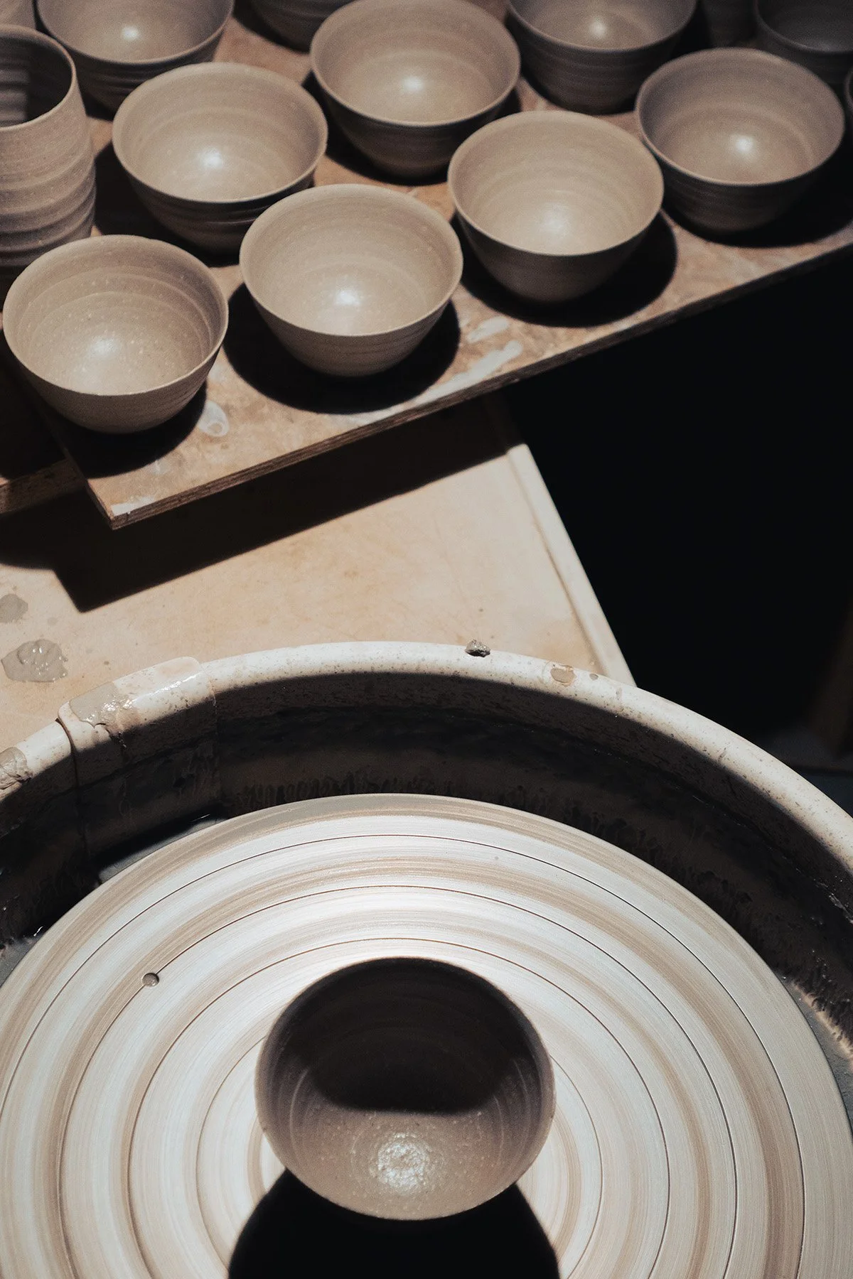 Quiet moments inside the pottery studio where handmade teaware and ceramic objects are created.