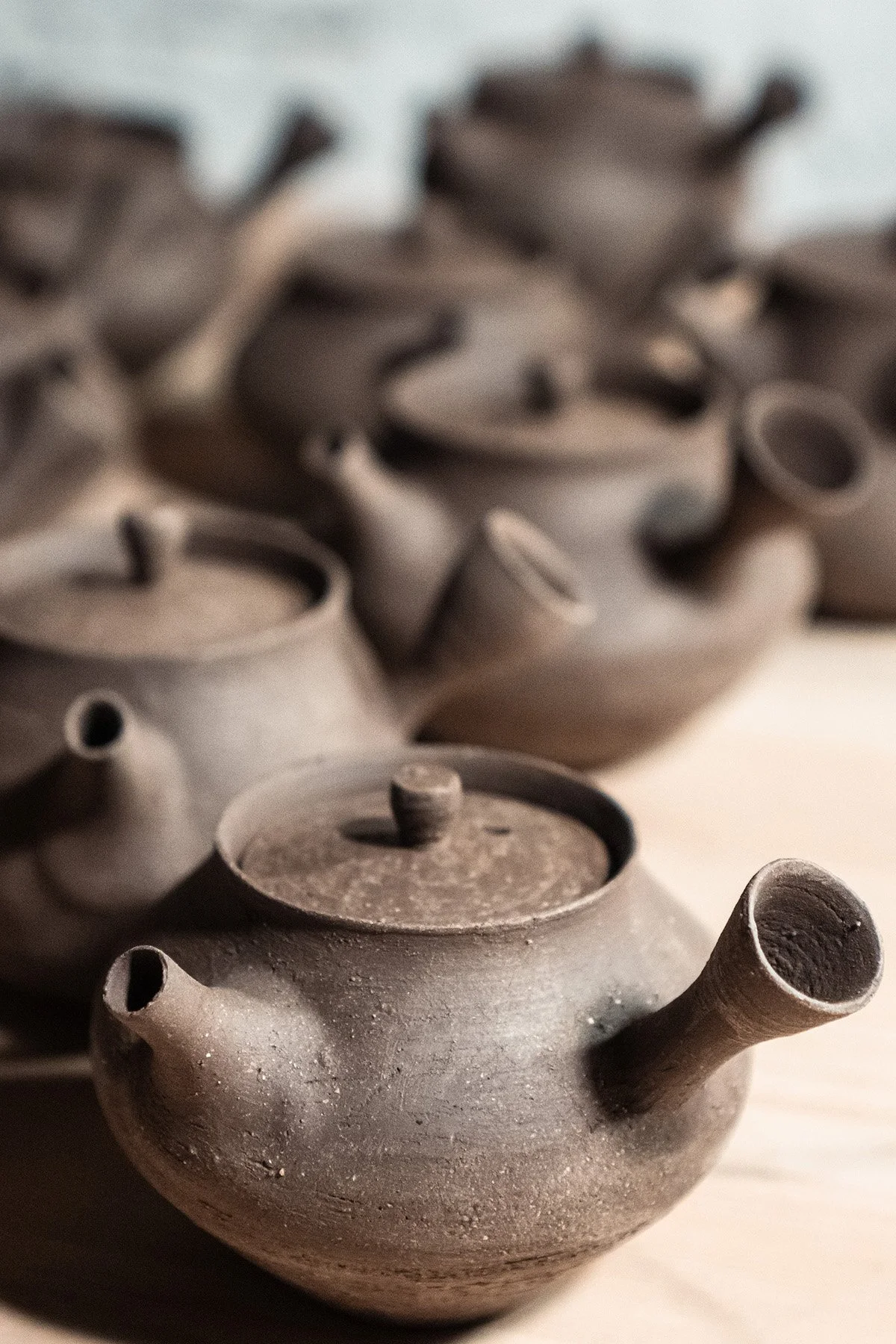 Handmaking ceramic kyusu teapots on the wheel as part of a slow pottery making process.