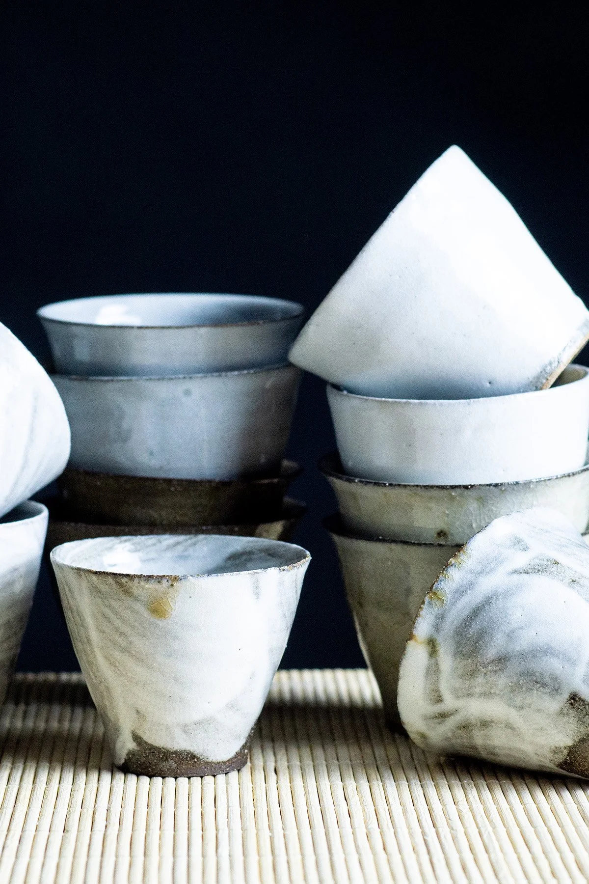 Ash glazed ceramic cups made for daily tea rituals, featuring soft textures and natural wood ash surfaces.
