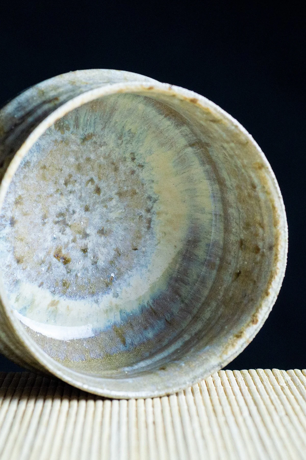 Wood fired ash glazed teaware with natural textures and surfaces shaped by flame and ash.