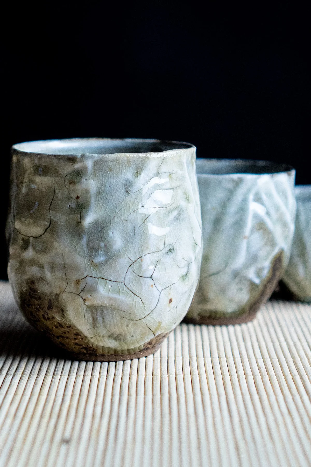Ash glazed ceramic cups made for daily tea rituals, featuring soft textures and natural wood ash surfaces.