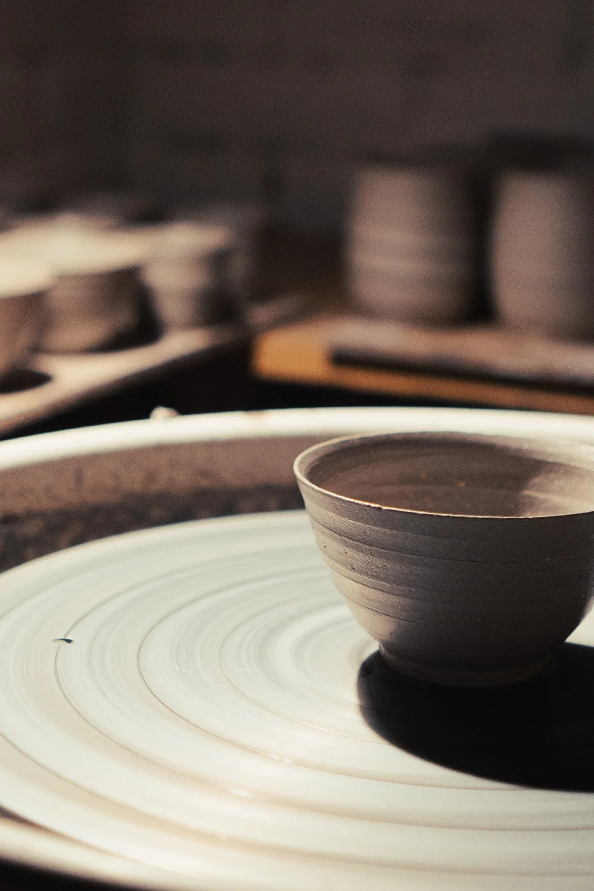 Quiet moments inside the pottery studio where handmade teaware and ceramic objects are created.
