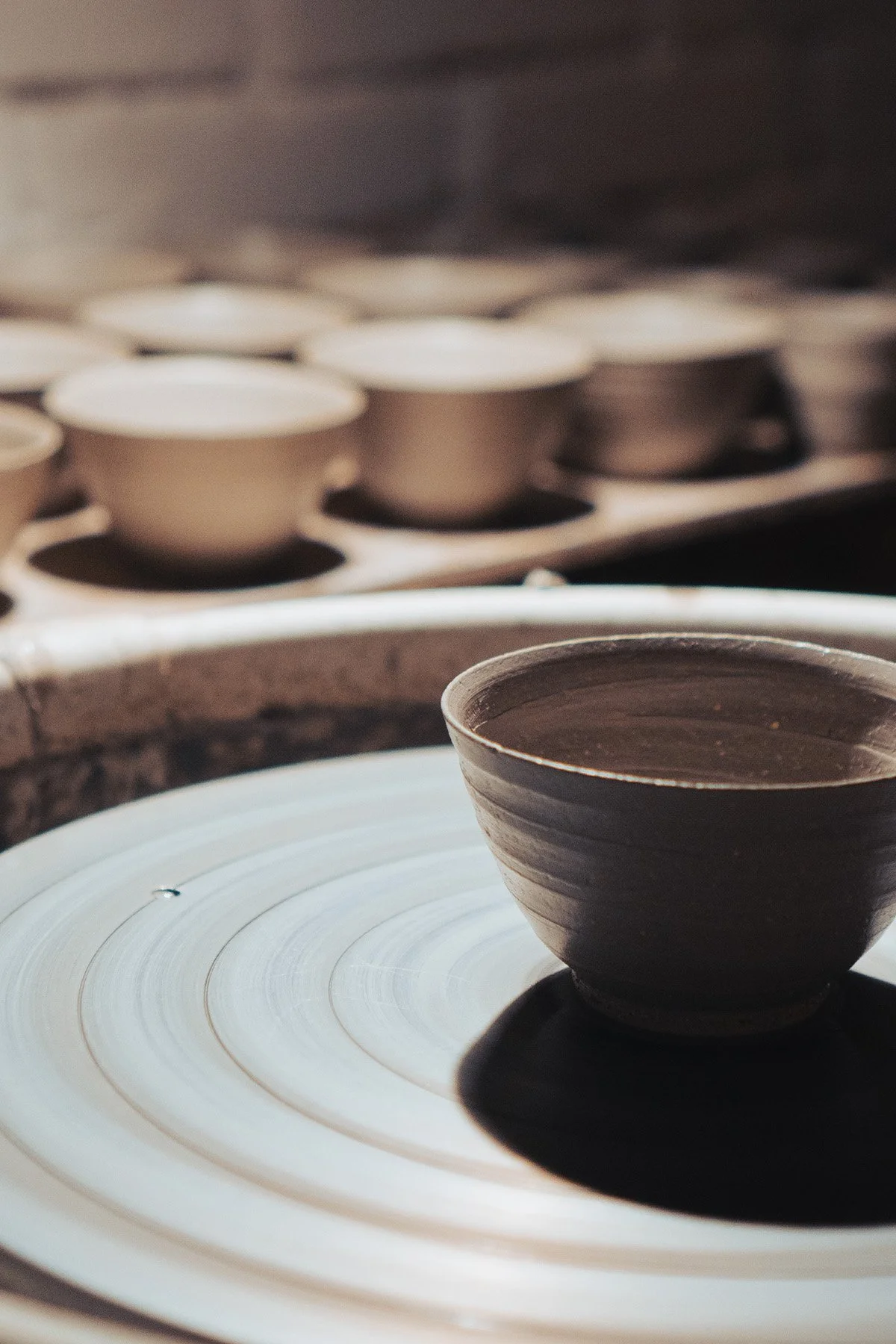 Quiet moments inside the pottery studio where handmade teaware and ceramic objects are created.