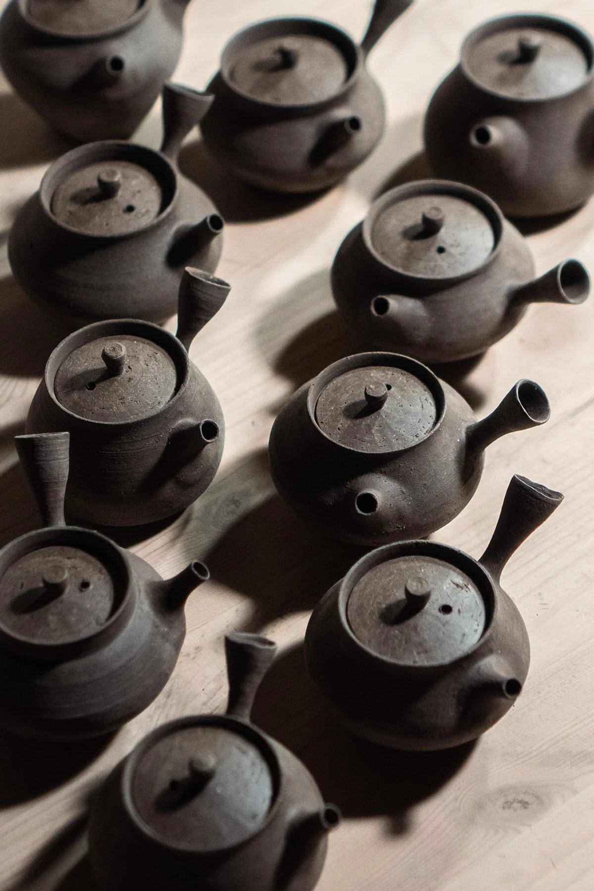 Handmaking ceramic kyusu teapots on the wheel as part of a slow pottery making process.