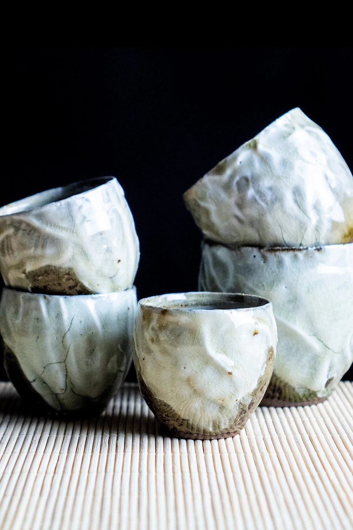 Ash glazed ceramic cups made for daily tea rituals, featuring soft textures and natural wood ash surfaces.