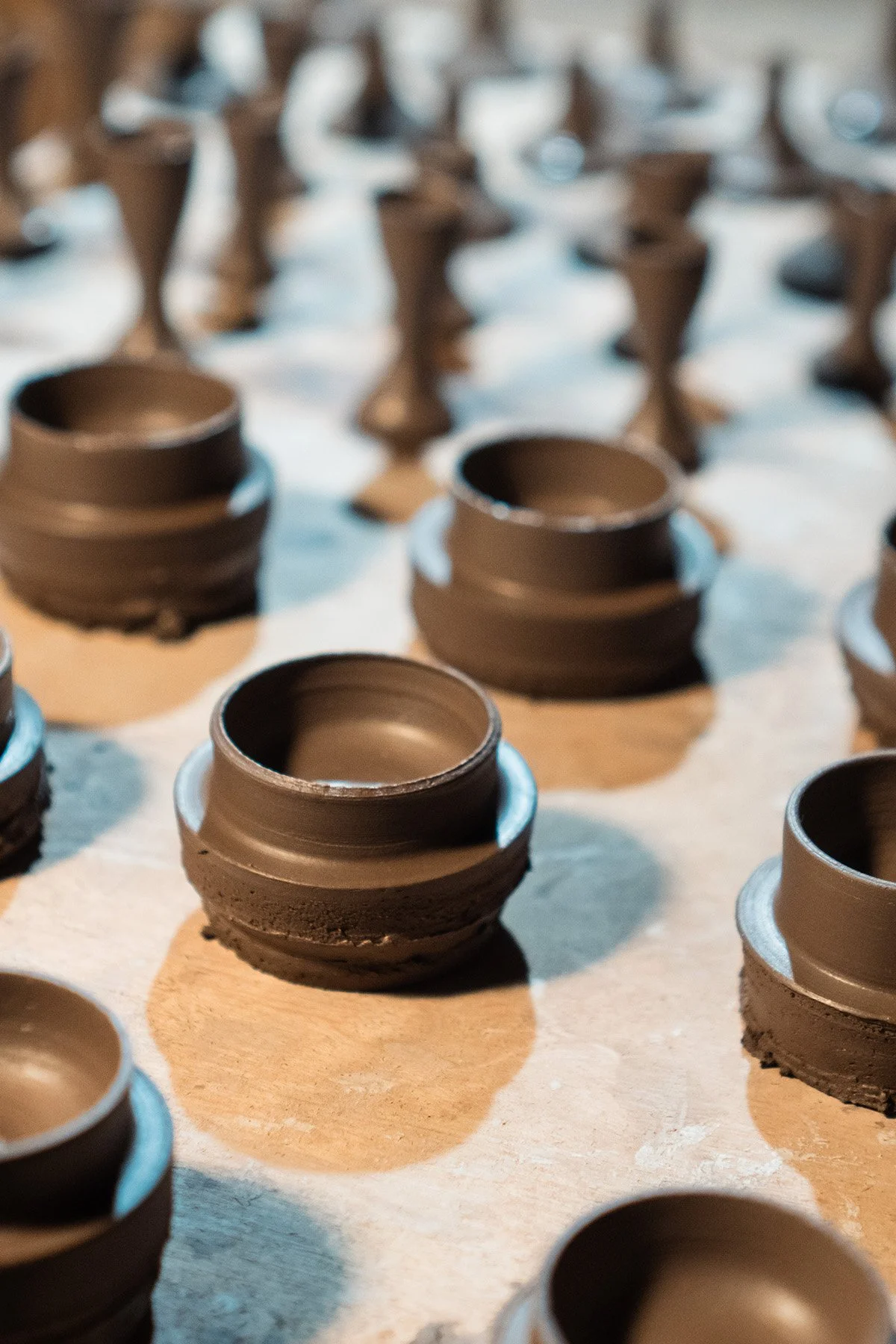 Handmaking ceramic kyusu teapots on the wheel as part of a slow pottery making process.