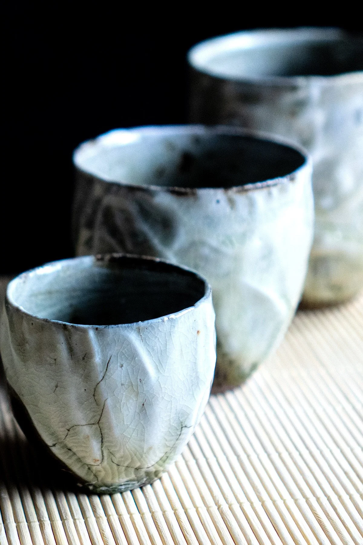 Ash glazed ceramic cups made for daily tea rituals, featuring soft textures and natural wood ash surfaces.