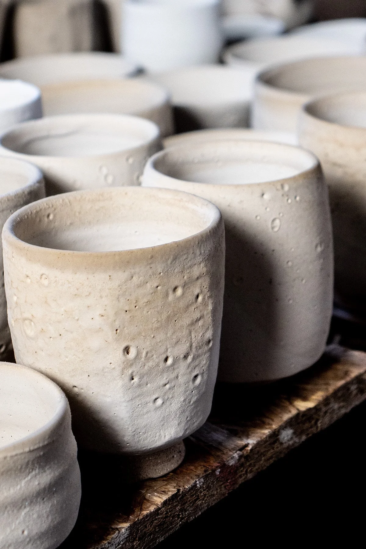 Drying pots glazed with Shino waiting to be pack into a soda kiln
