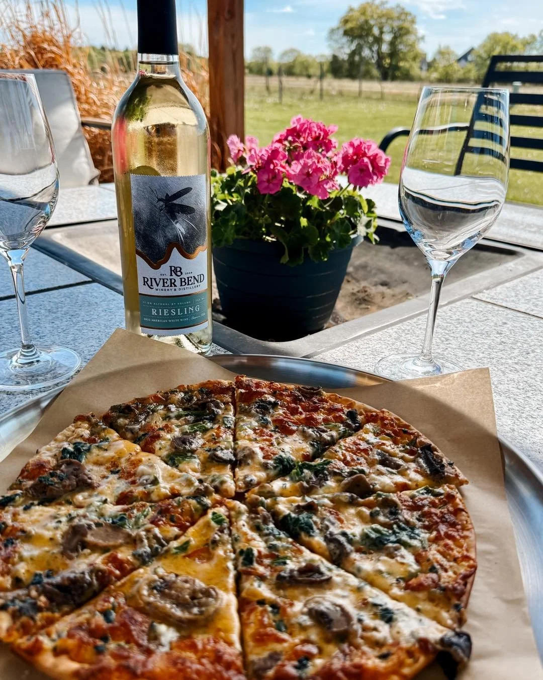 Wine + pizza on the patio just feels like summer at River Bend. 🍕🍷

Don&rsquo;t forget, we now serve pizza on days without a food truck! And yes, we now have gluten free options available!
