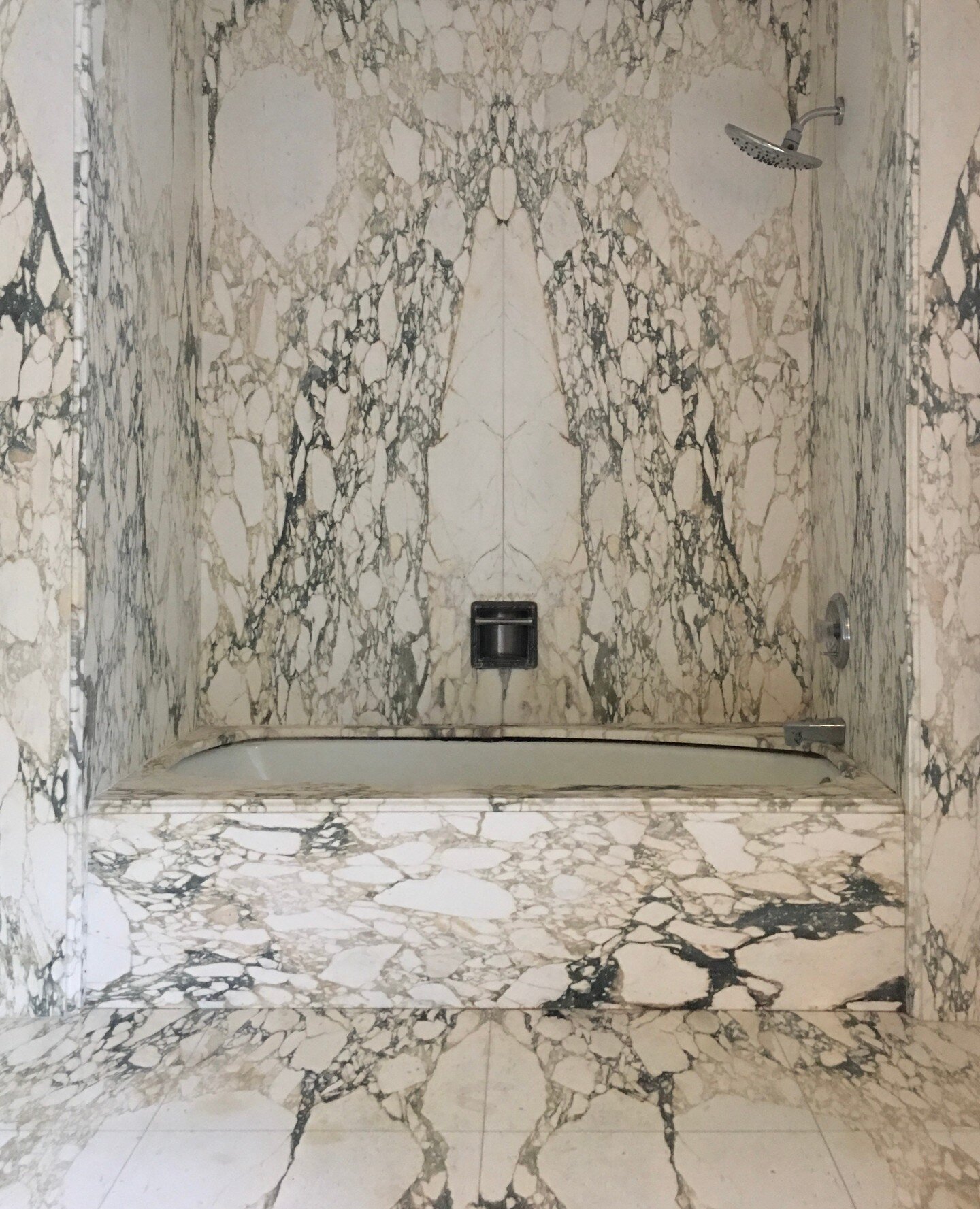 We are planning to clad an entire bathroom in book matched marble slabs at a project we are working on in LA. Pictured here is my favorite bathroom in my dad's house. I have loved it since I was a little girl. 🖤