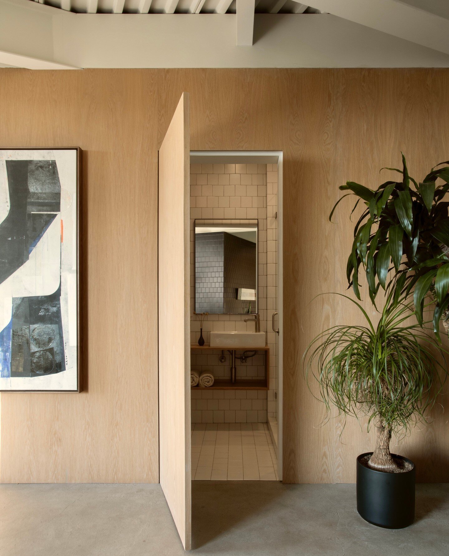 Thanks to @wallpapermag for the online feature of our Olancha project!⁠
.⁠
This tiny bathroom is hidden in the white oak wall paneling under the staircase. When the door is closed, you don't even know it is there.⁠
photo @marciaprentice⁠
#sarahrosenh