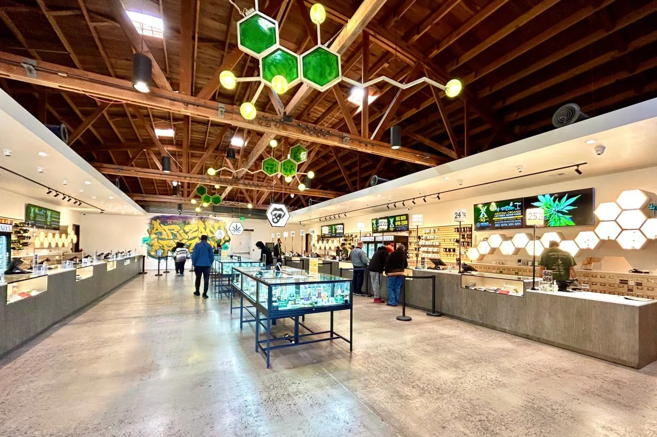 Arizona Organix wide interior view showing hexagon displays, glass cases, and open retail floor