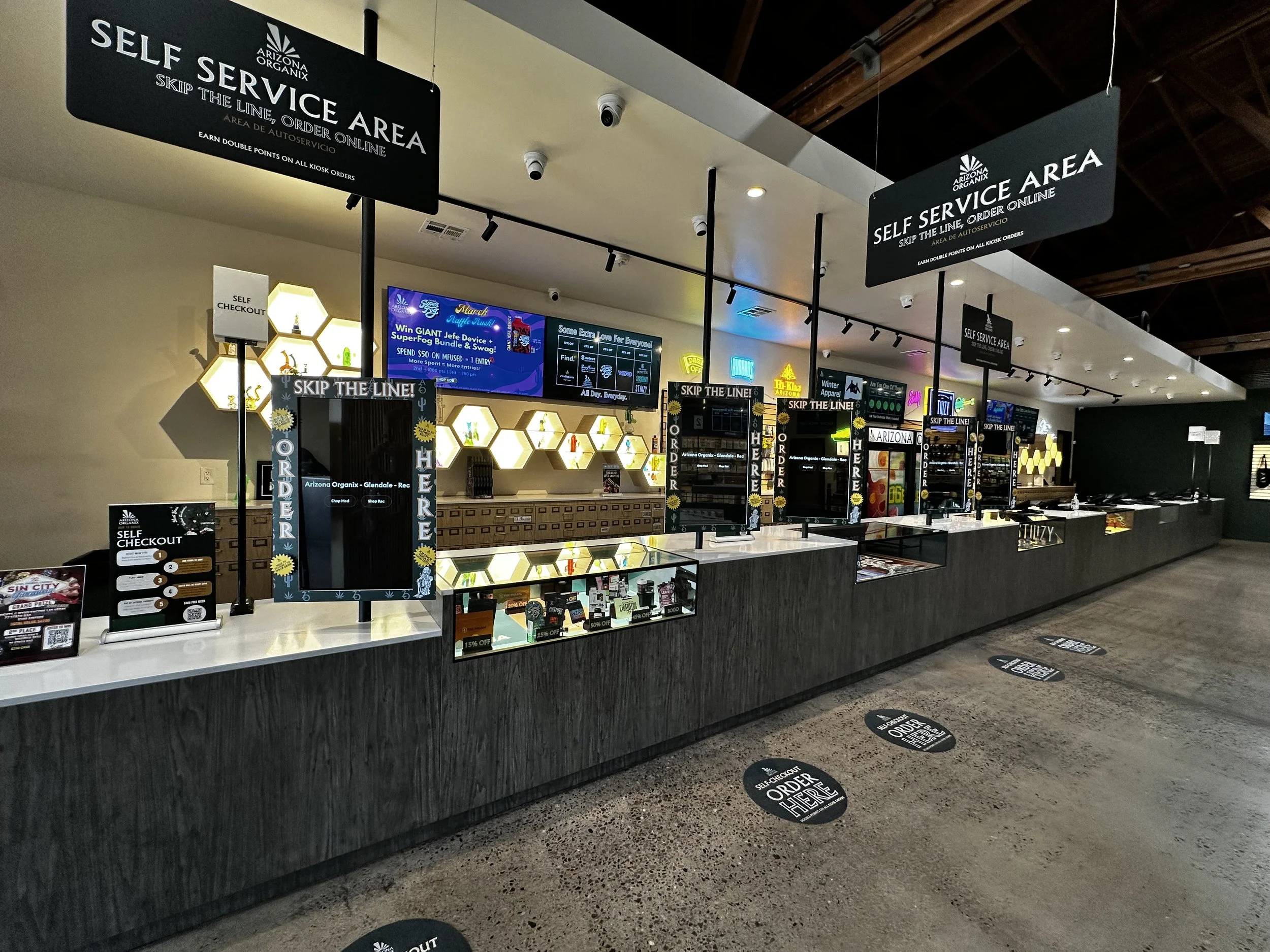Inside Arizona Organix - spacious retail floor with glowing hexagon product displays and self-service area