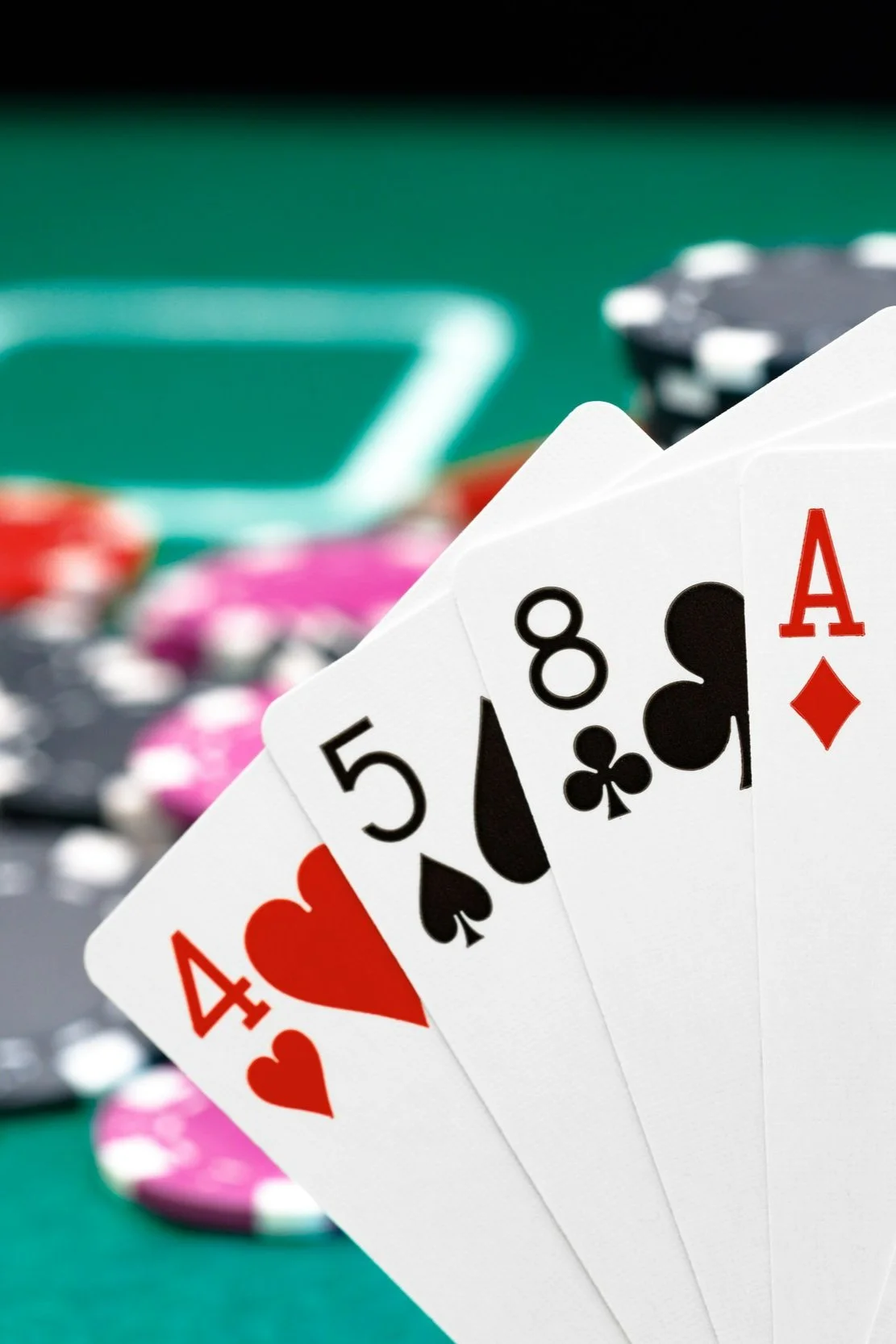 playing-cards-and-chips-on-green-casino-table-back-2021-09-03-13-01-26-utc.jpg