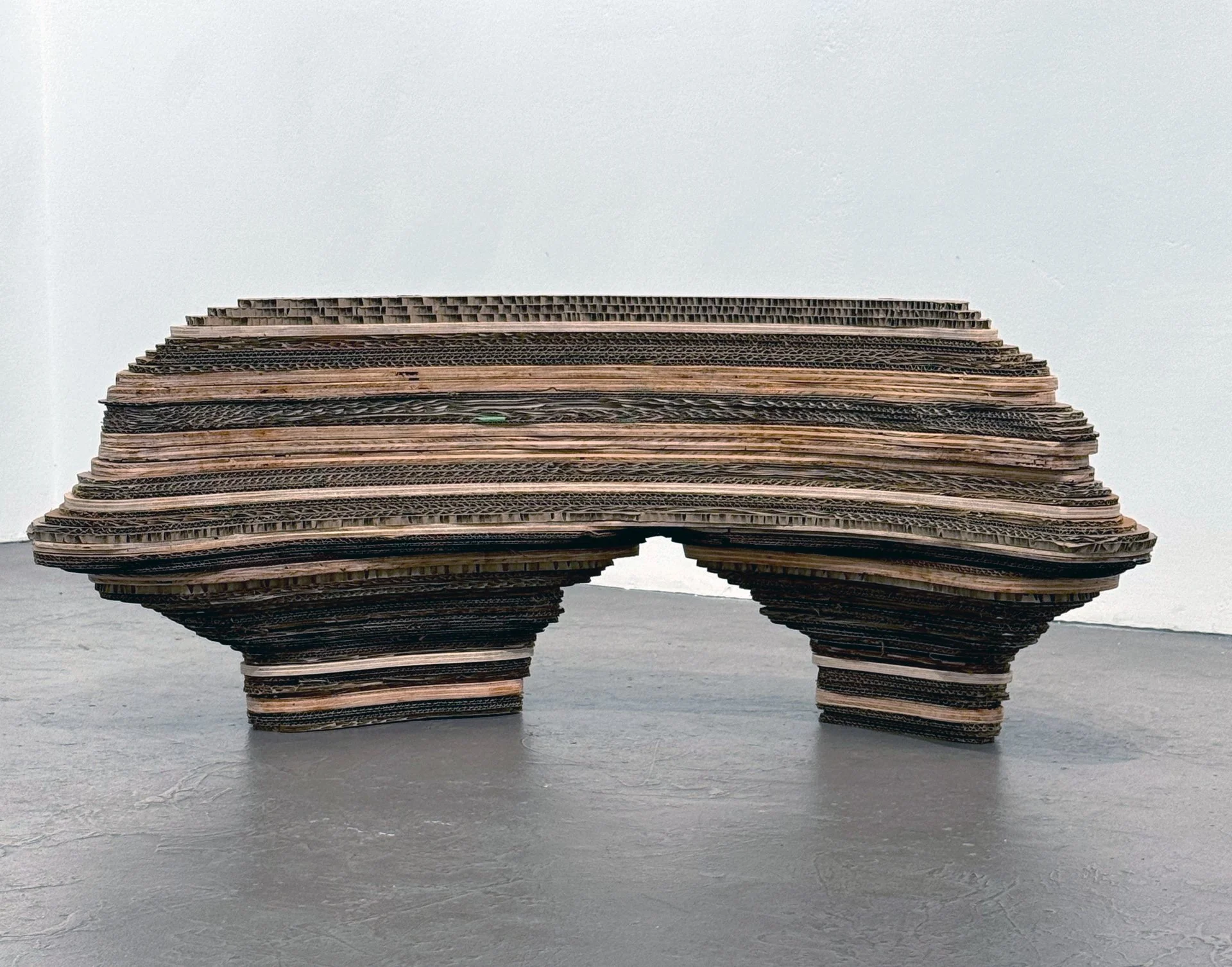 Barry Beach   from the Folded and Layered series [Guardian Figure], 2025, reclaimed cardboard and wood, 21" x 21" x 48"