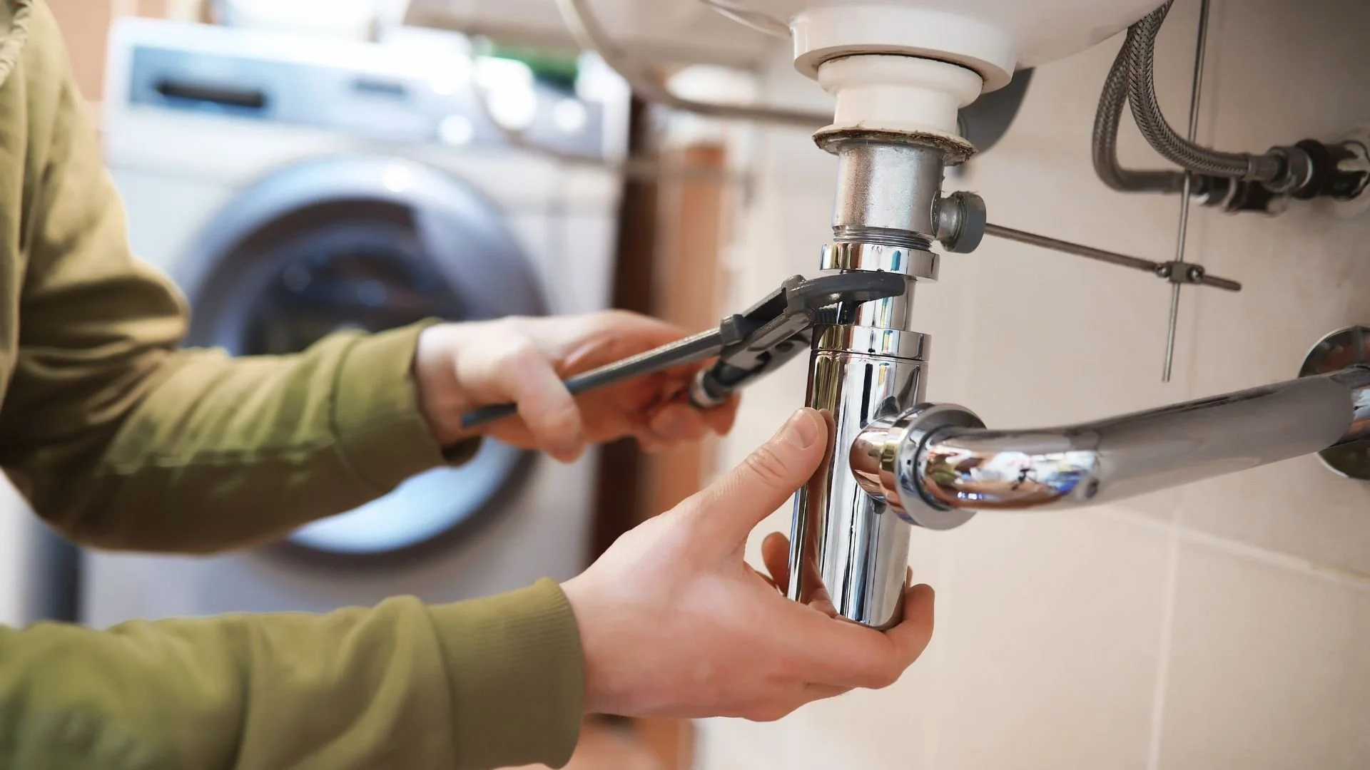 landlord fixing plumbing in active real estate investment vs. passive investment