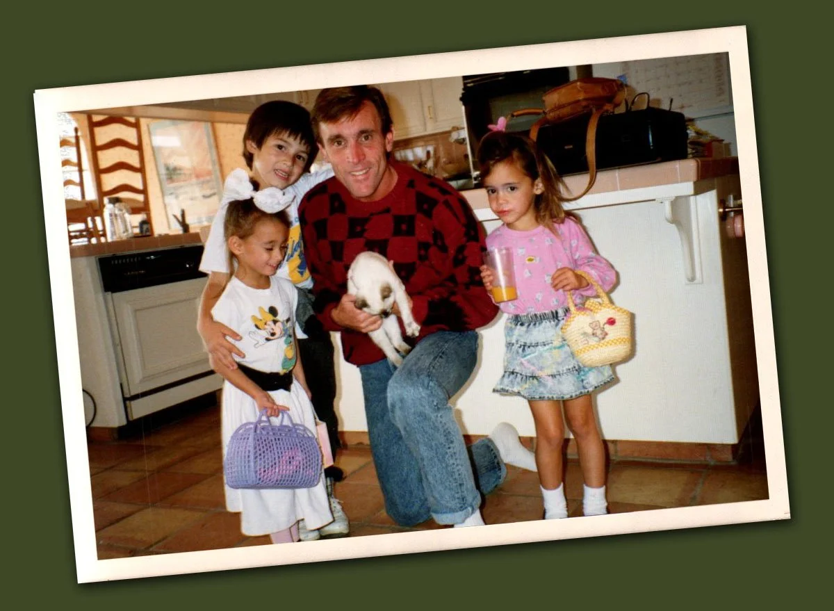 vintage family photo from the early 90s of a father and three young children